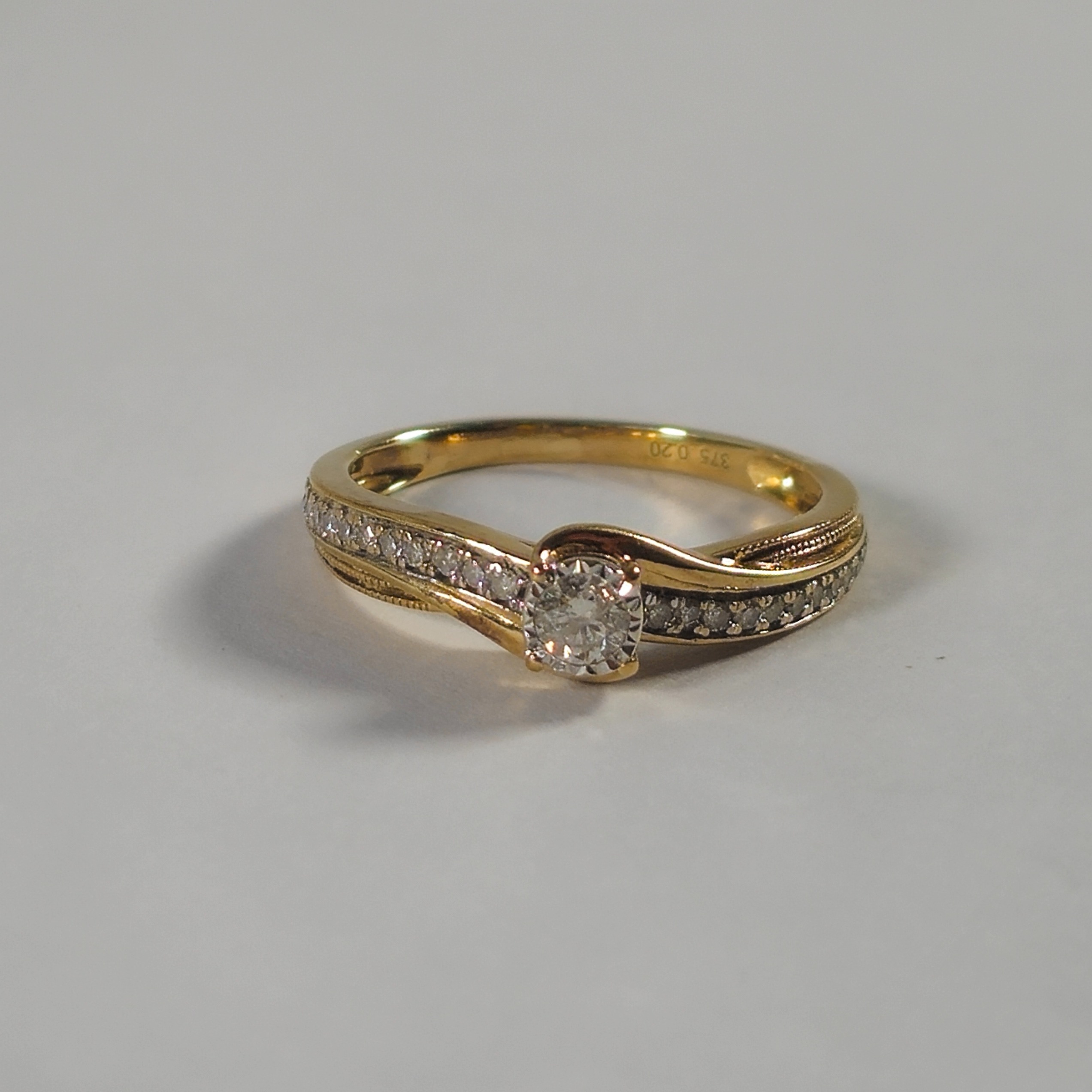 Product photo for 9ct Gold 0.20ct Diamond Solitaire Infinity Twisted Shoulder Style Engagement Ring Size K1/2