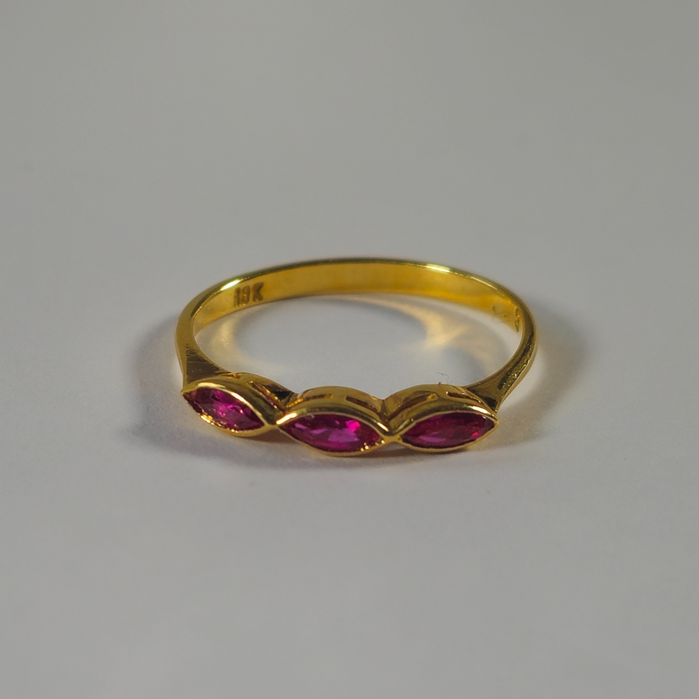 Product photo for 18ct Gold Marquise Red Stone Trilogy Style Ring Size K1/2
