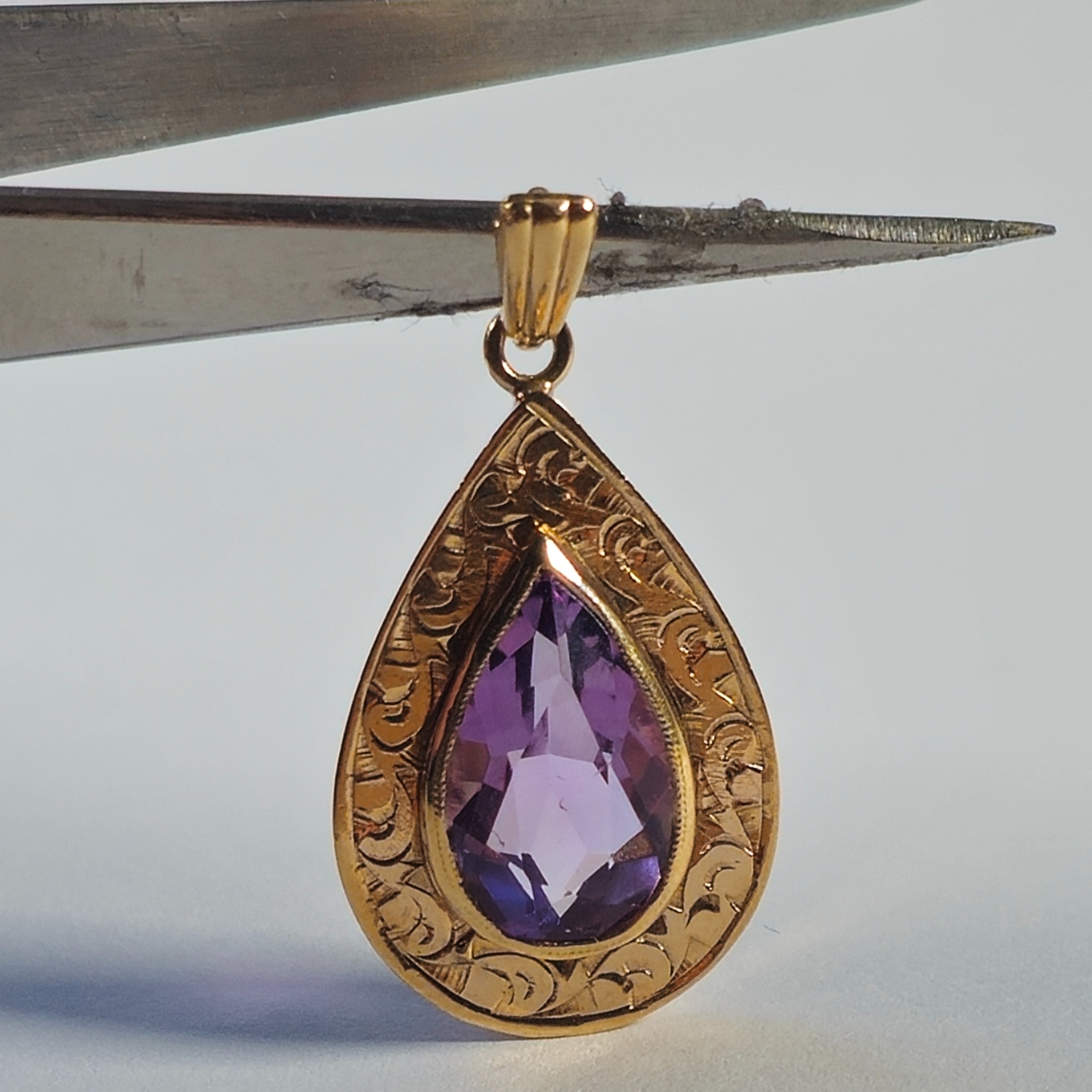 Product photo for 9ct Gold Pear Shaped Purple Stone Engagement Pendant