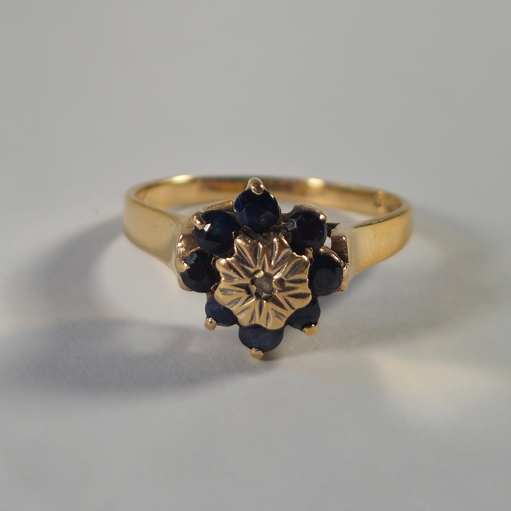 Product photo for 9ct Gold Sapphire & Tiny White Stone Flower Ring Size O1/2