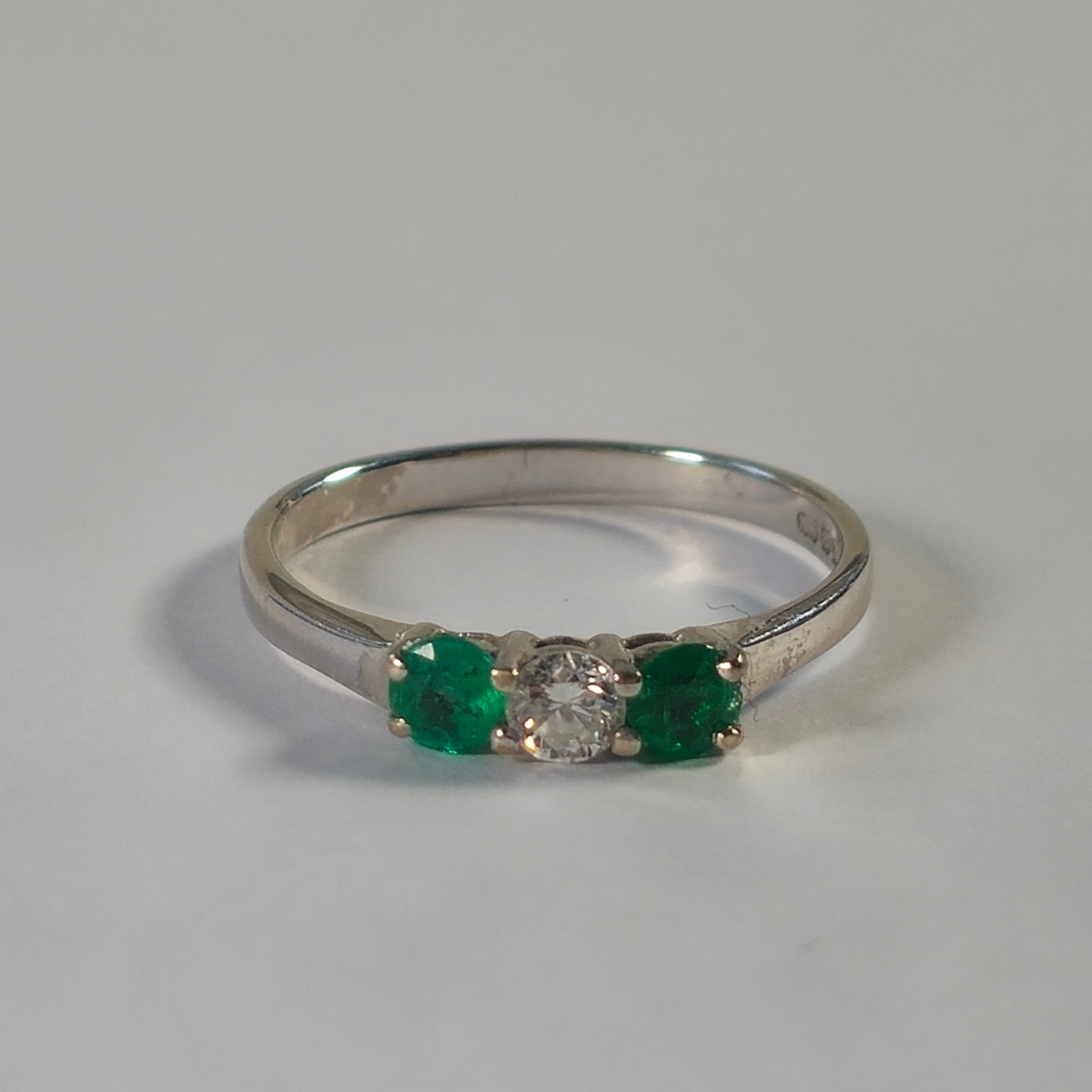 Product photo for 18ct White Gold Emerald & Diamond Trilogy Ring Size O