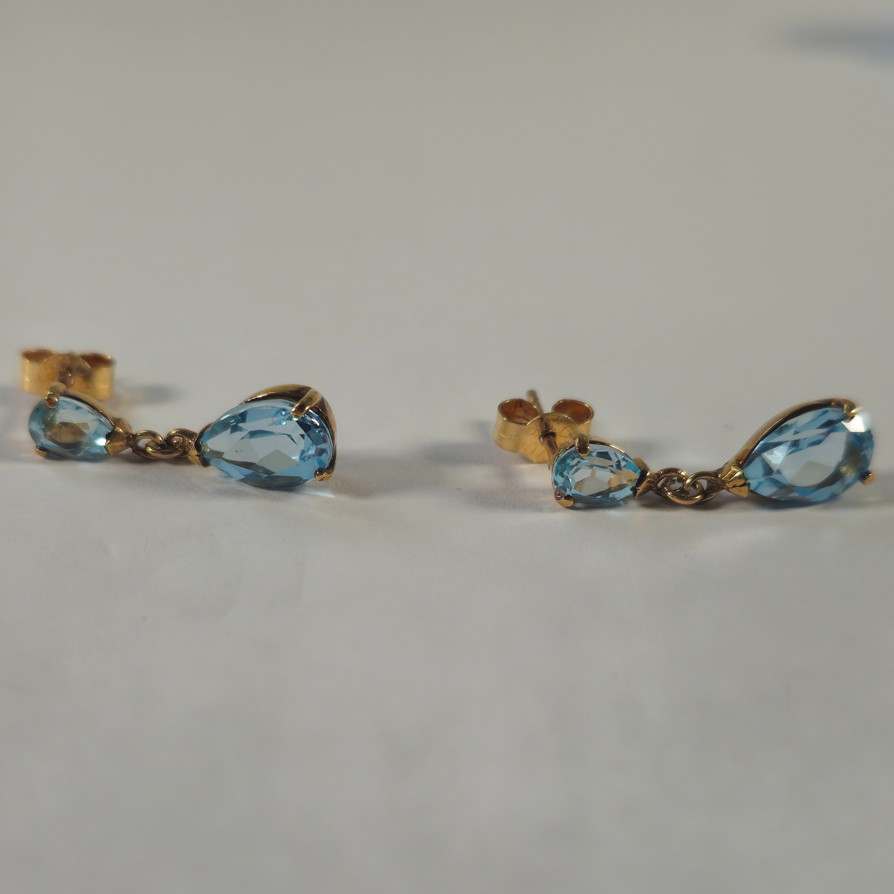 Product photo for 9ct Gold Blue Stone Tear Dropped Earrings
