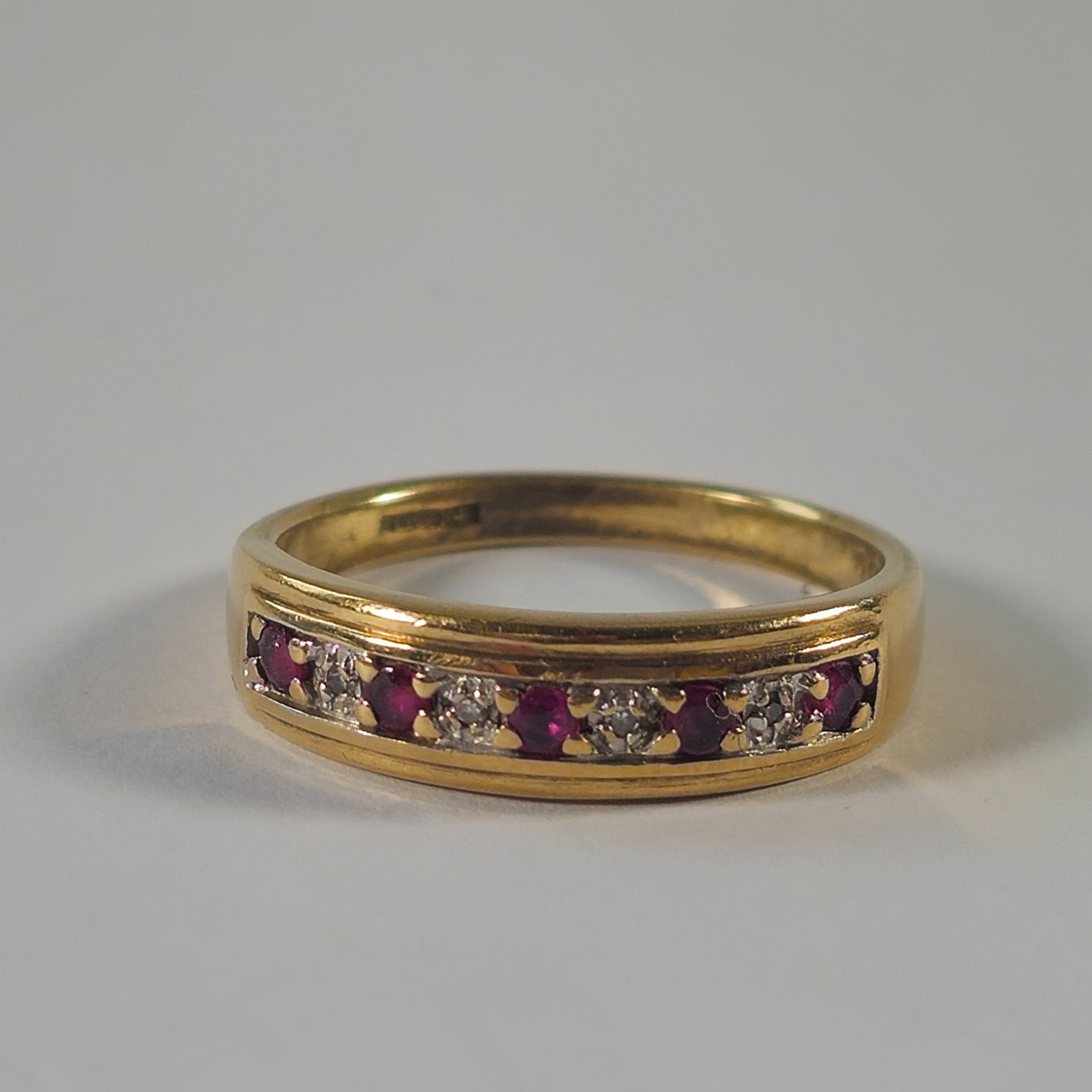 Product photo for 9ct Gold Ruby & Diamond Half Band Ring Size O