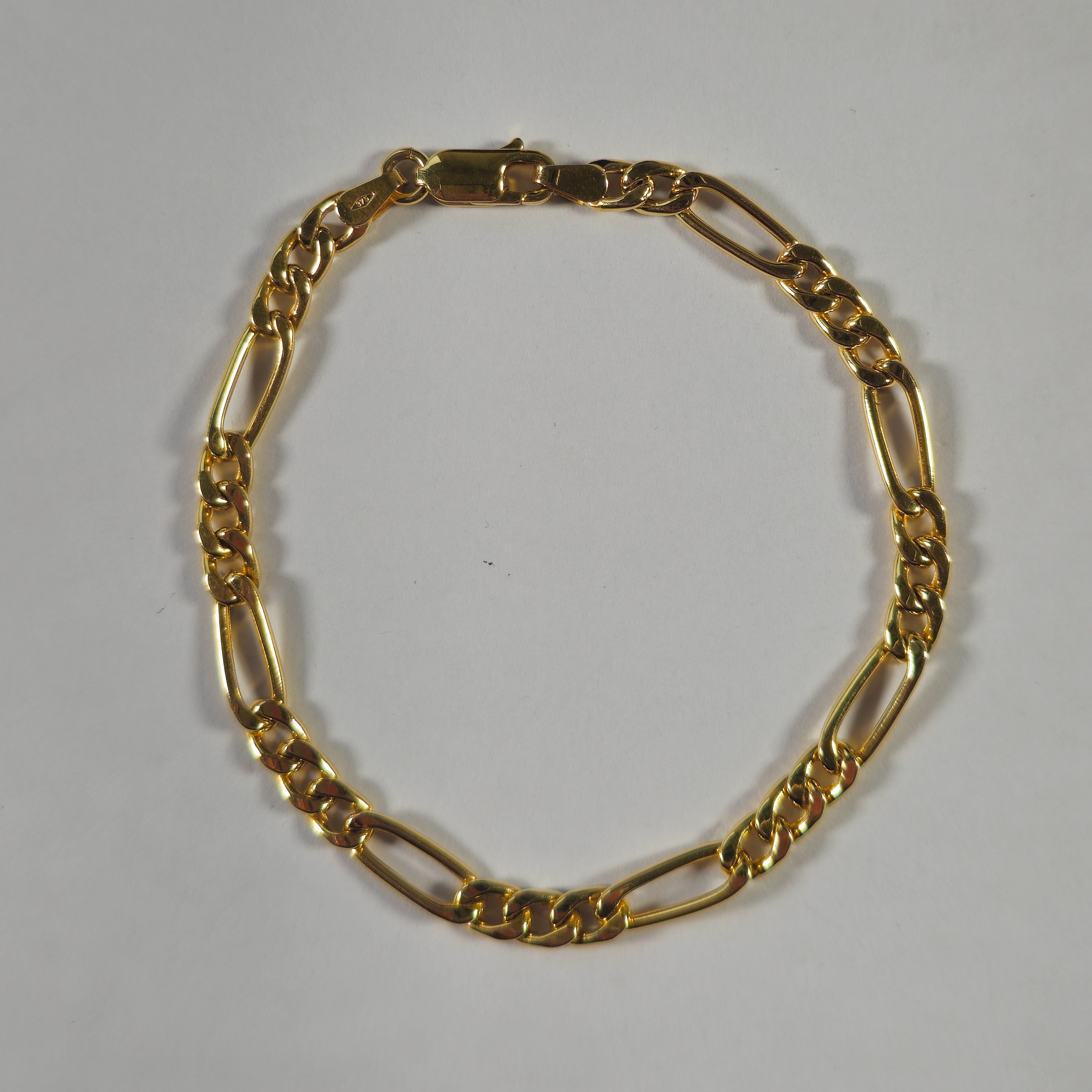 Product photo for 9ct Gold Hollow Figaro Bracelet 7.2