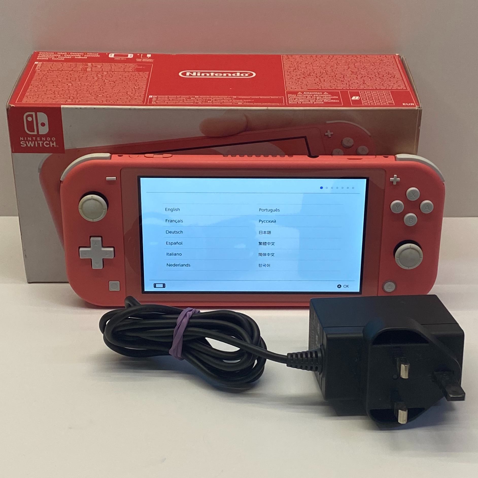 Product photo for Nintendo Switch Lite Handheld Console in Coral Boxed