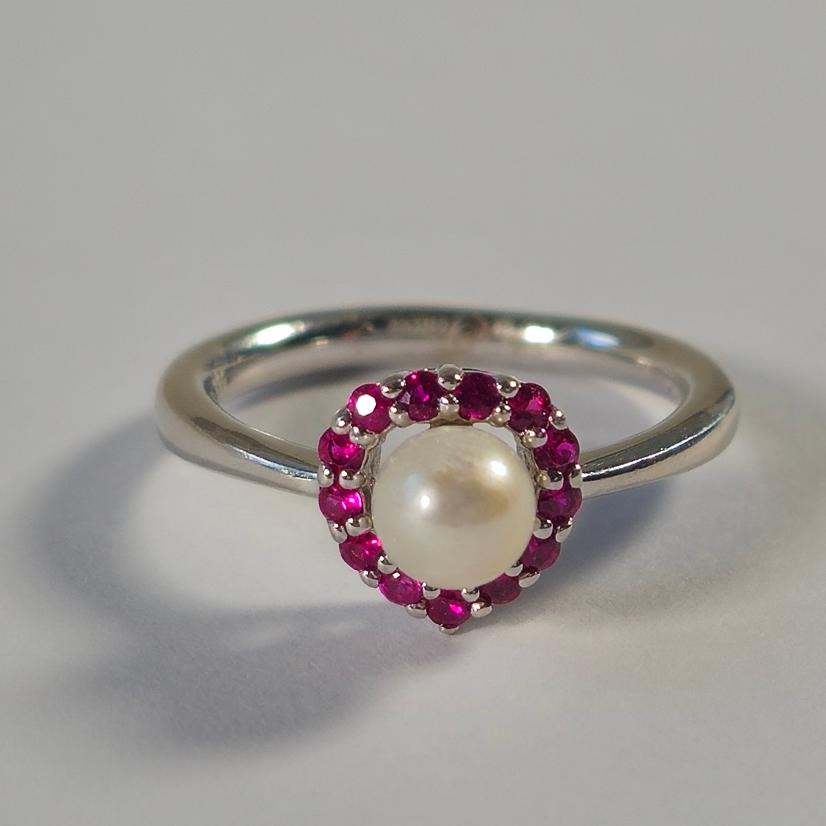 Product photo for 14ct White Gold Ruby & Pearl Pear Shape Halo Engagement Style Ring Size H1/2