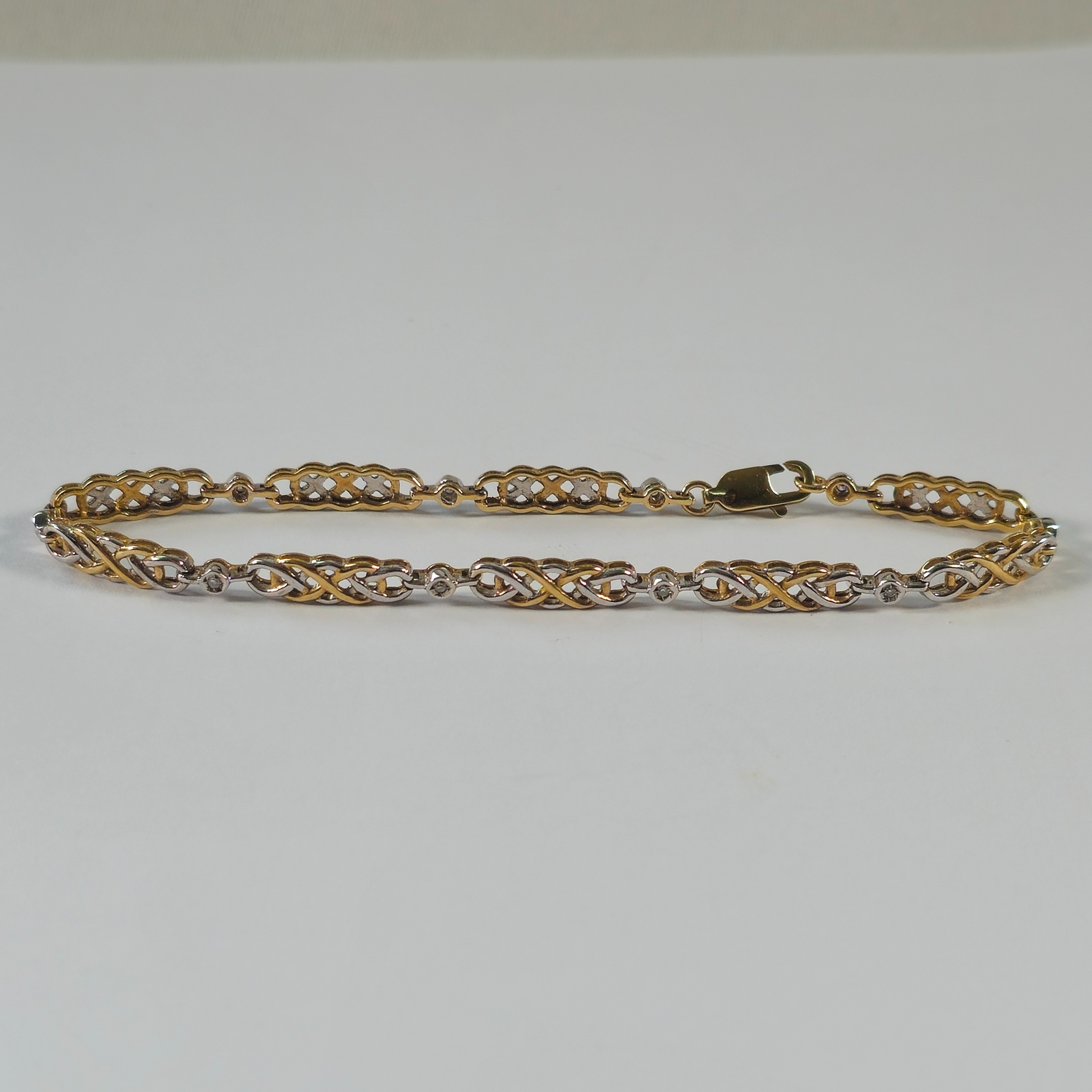 Product photo for 9ct Gold Diamond 2-tone Celtic Link Bar Bracelet 7.4
