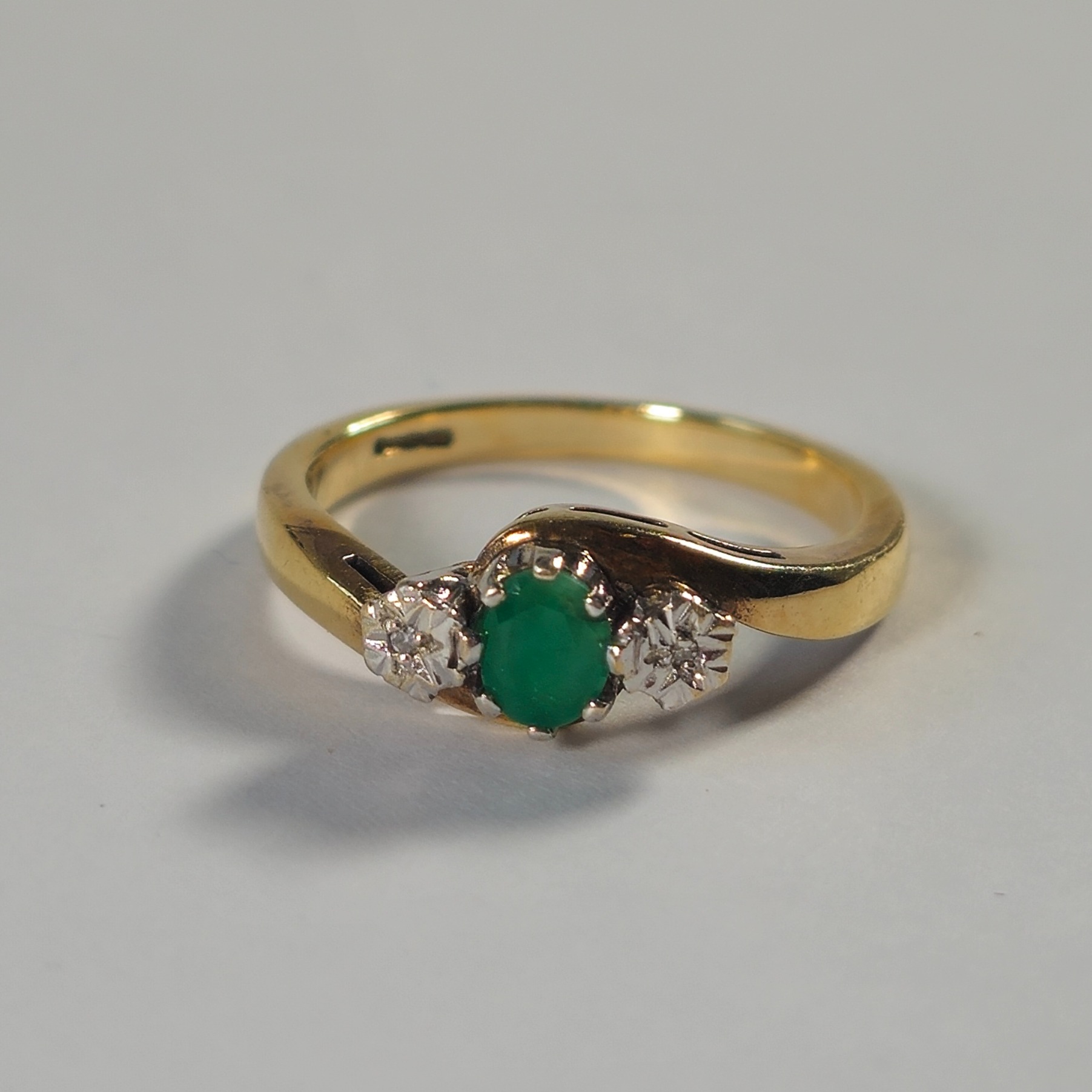 Product photo for 9ct Gold Green & White Stone Twisted Style Trilogy Ring Size O1/2