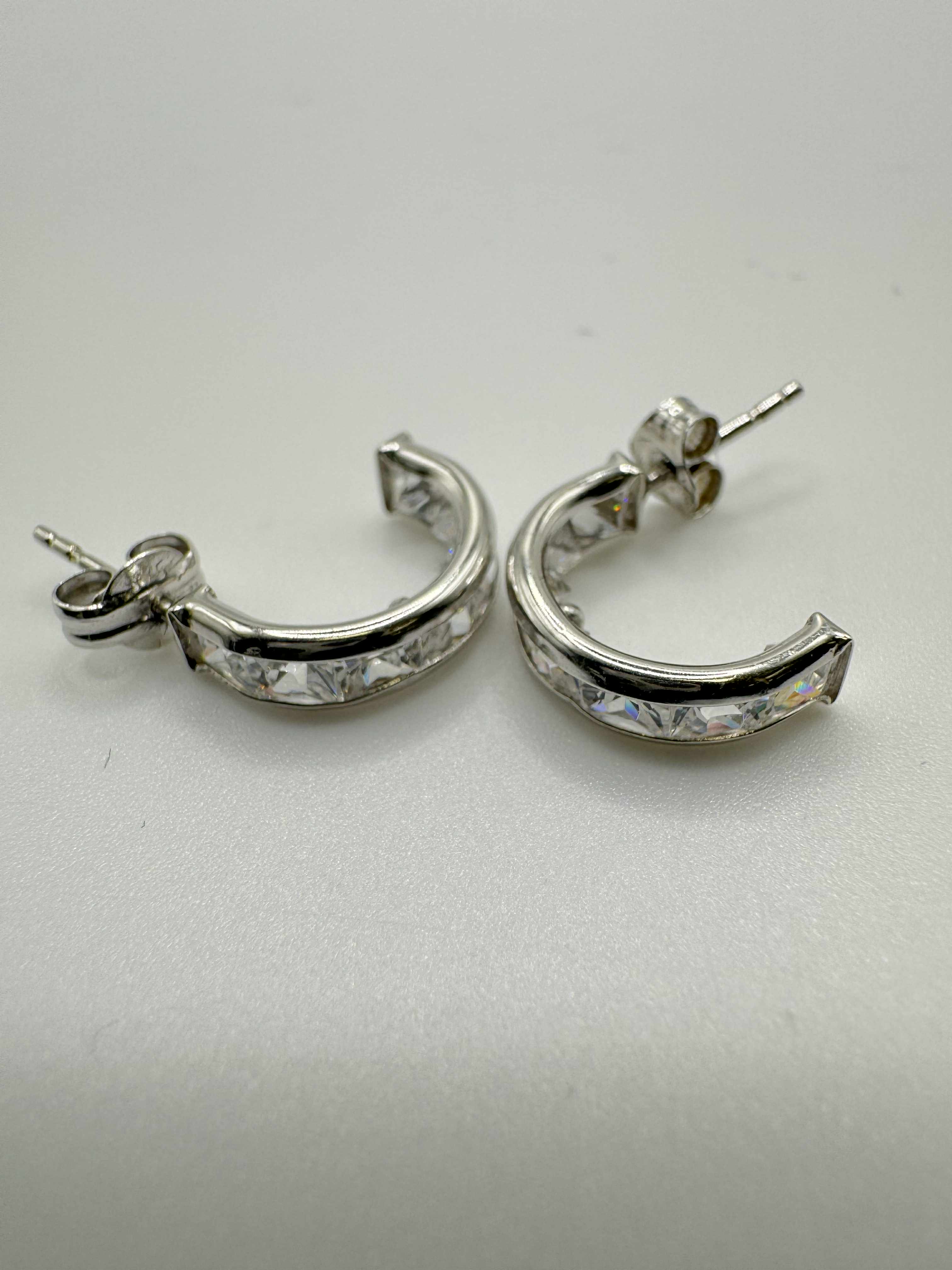 Product photo for 9ct White Gold CZ Huggie Earrings