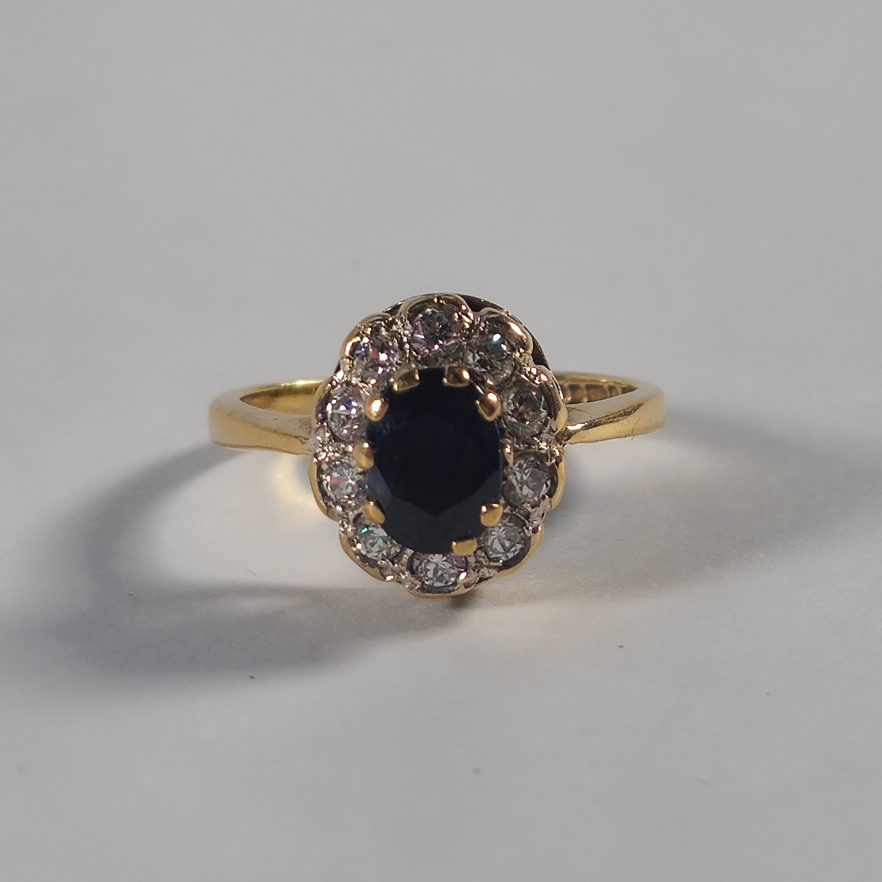 Product photo for 9ct Gold Oval Blue Sapphire & *CZ* Flower Ring Size J