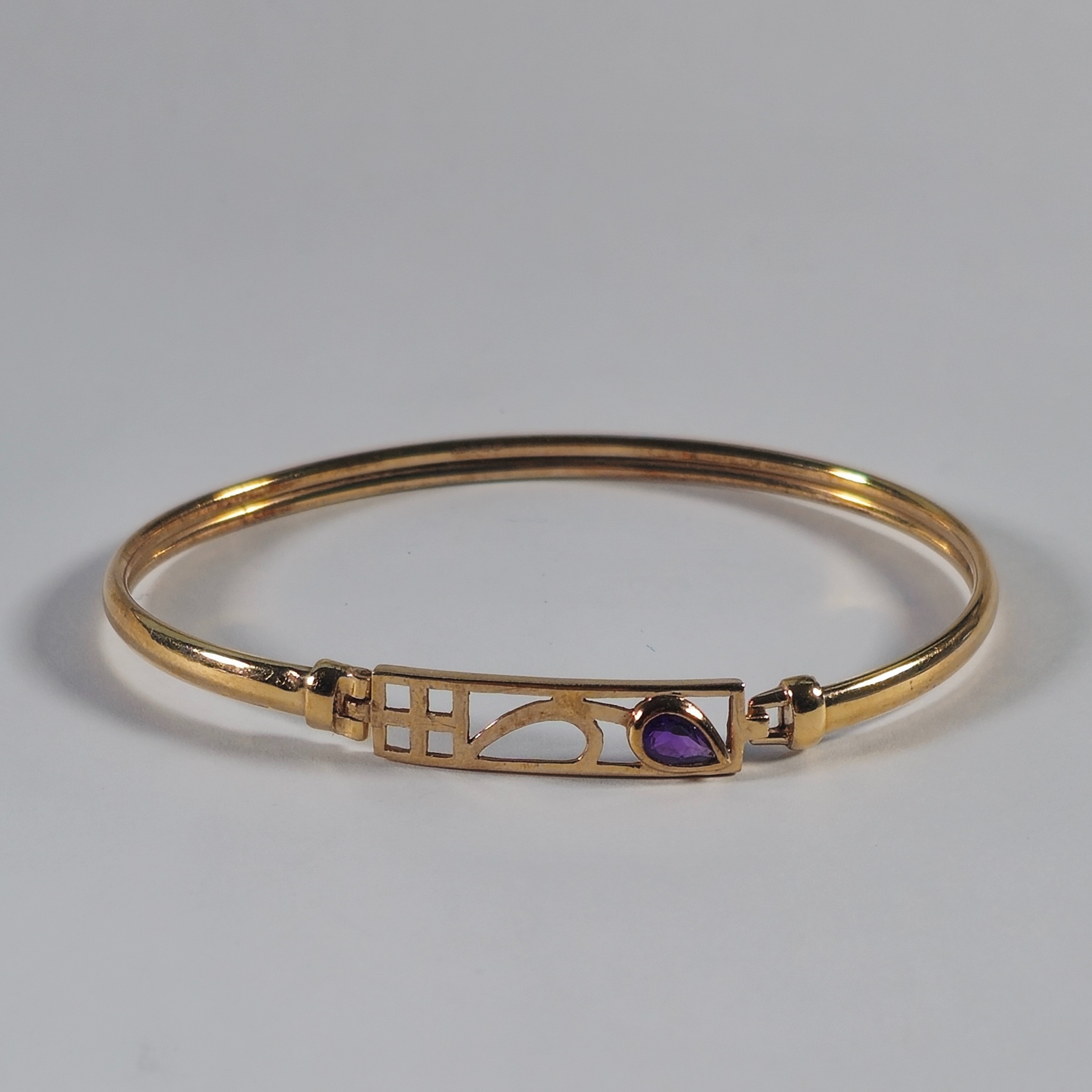 Product photo for 9ct Gold Pear Shape Purple Stone Bangle