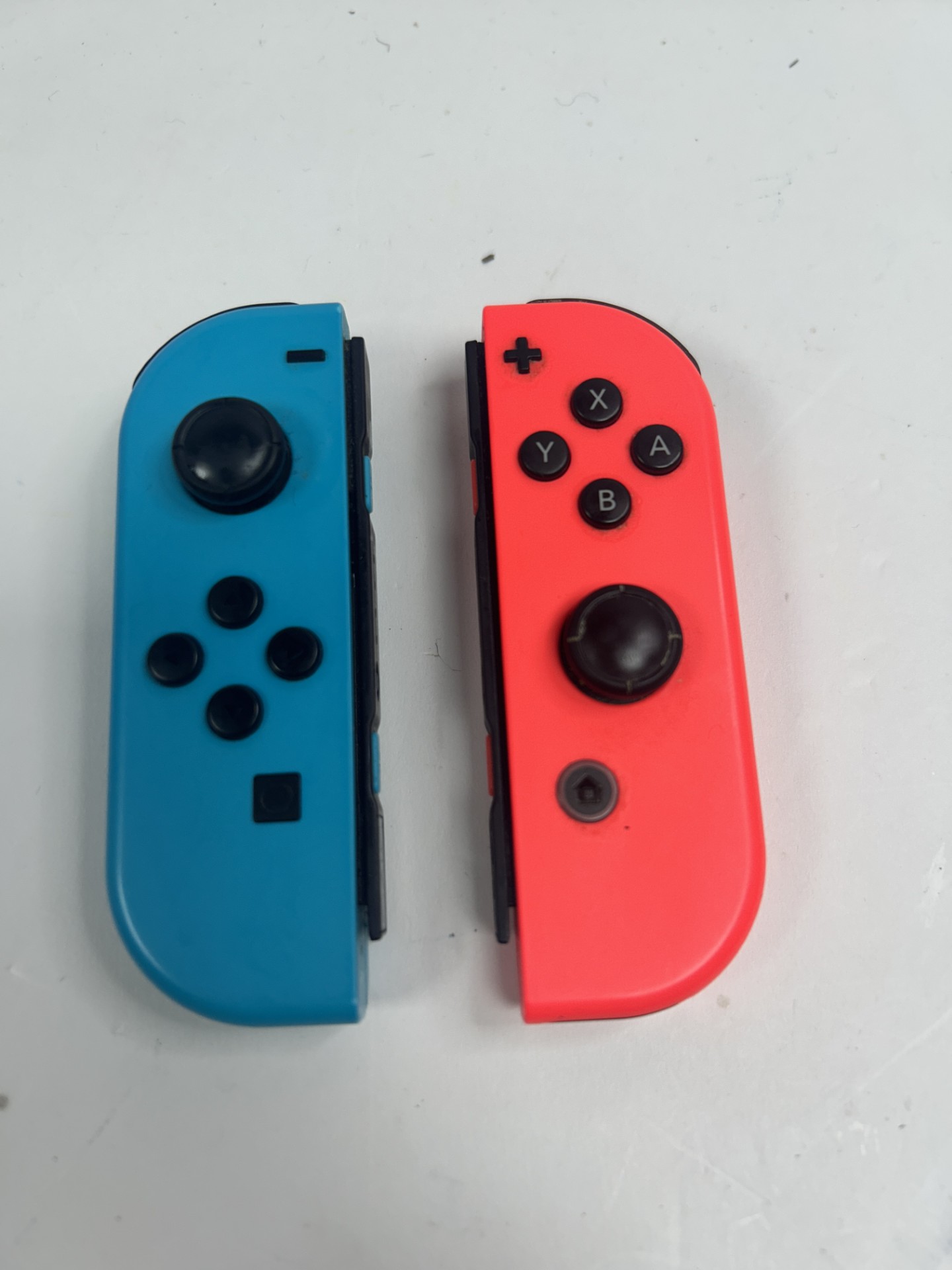 Product photo for Nintendo switch joy cons red and blue unboxed