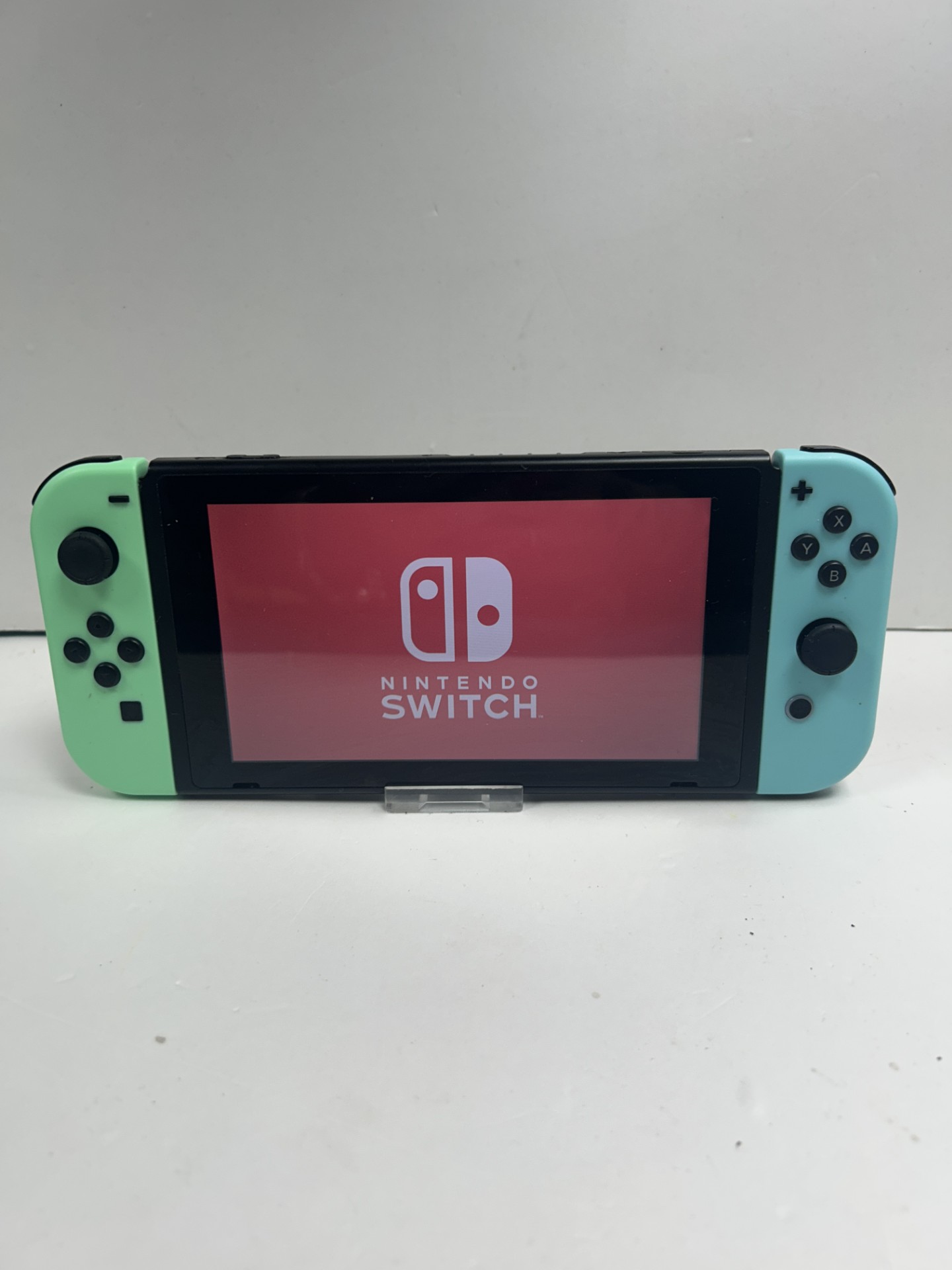Product photo for Nintendo switch console 32gb green blue joy-cons does have cracked back unboxed