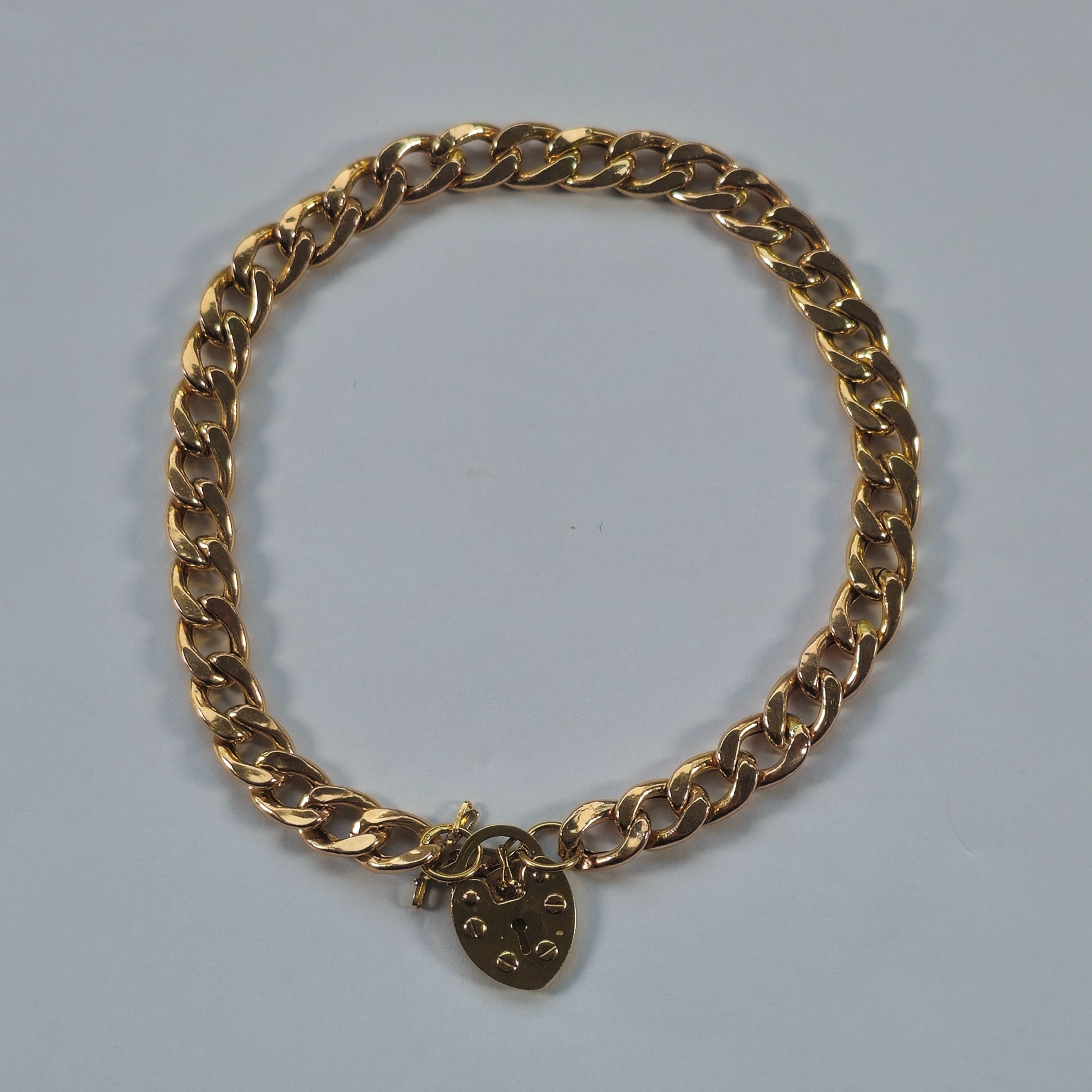 Product photo for 9ct Gold Hollow Curb Heart Padlock Bracelet