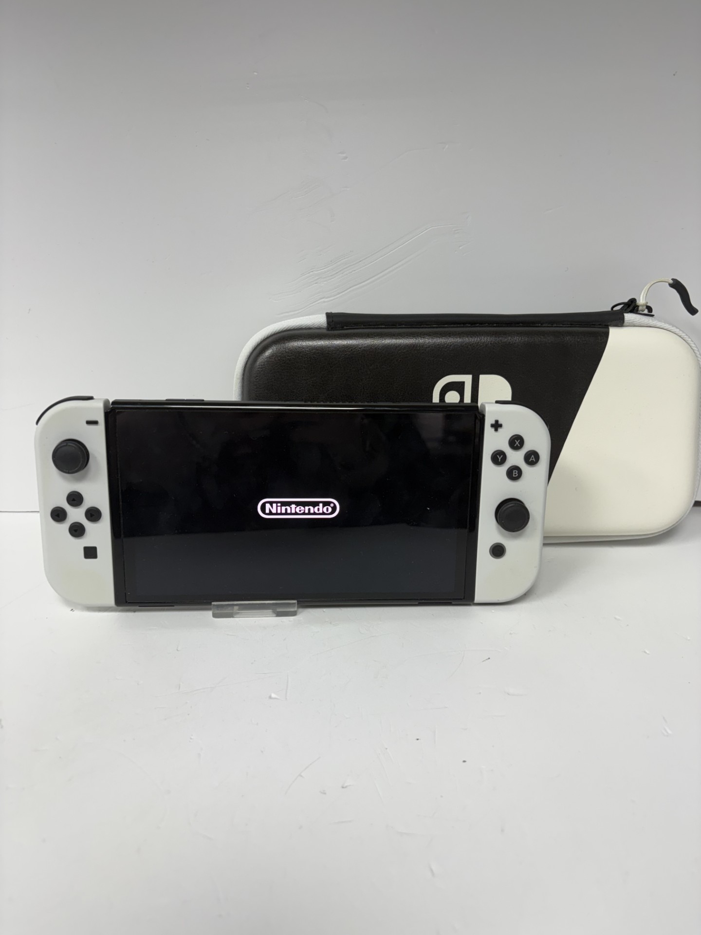 Product photo for NINTENDO SWITCH OLED WITH DOCKING STATION IN BLACK/WHITE CASE WHITE UNBOXED