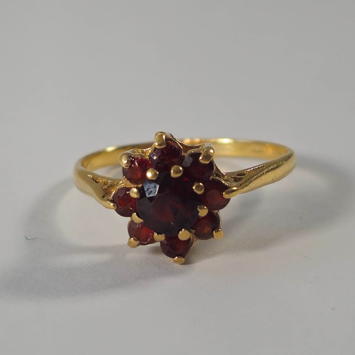 Product photo for 9ct Gold Red Stone Flower Ring Size O1/2