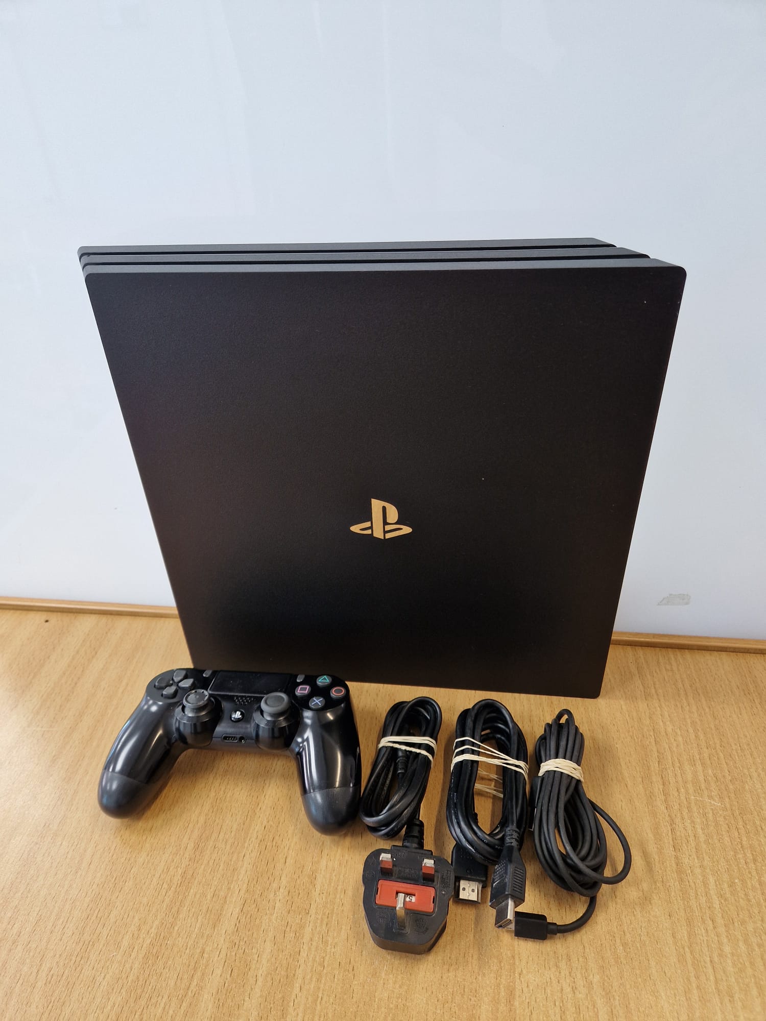 Product photo for Sony  Sony PlayStation 4 Pro 1TB Console w/ Worn Official Controller - 12M Warranty