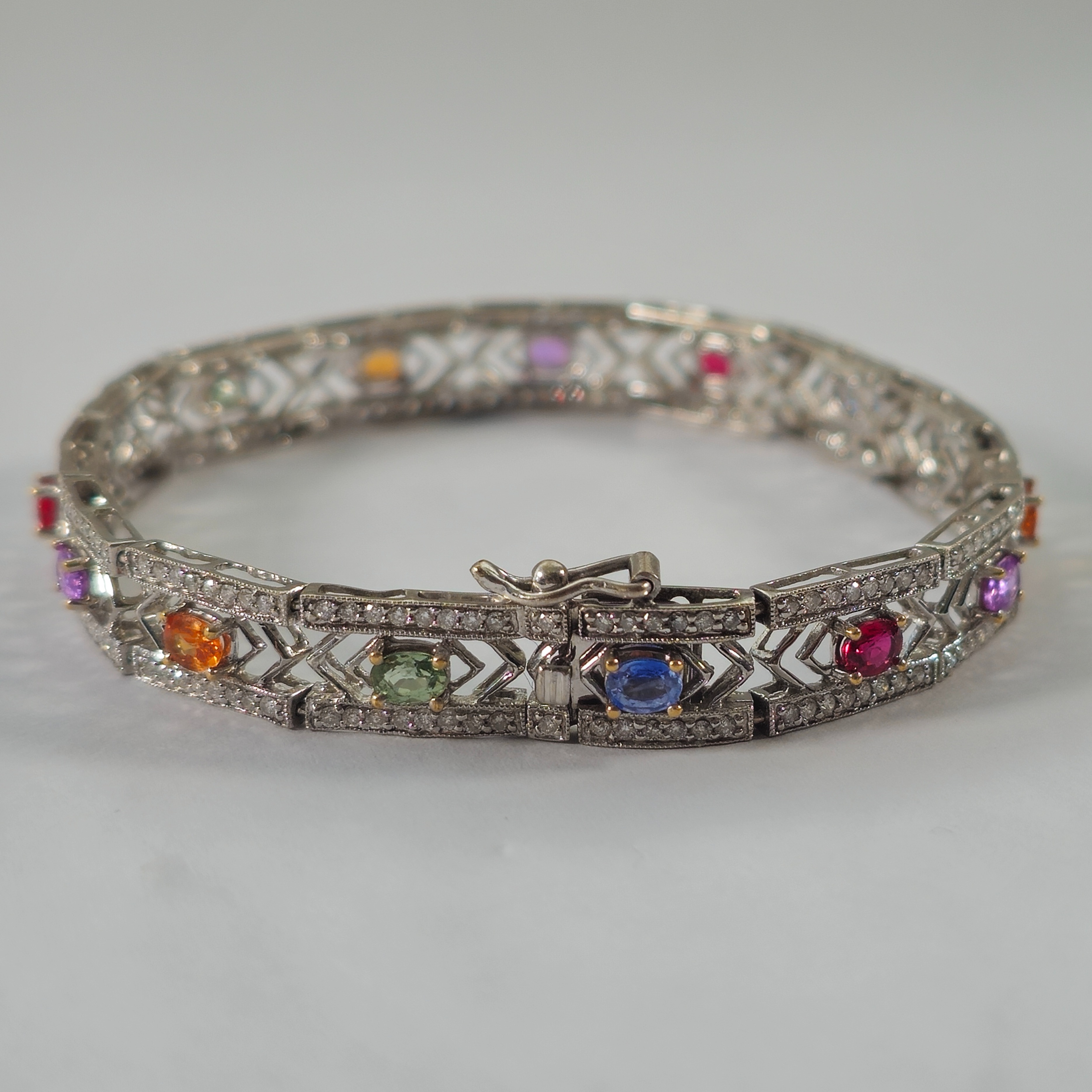 Product photo for 18ct White Gold Diamond & Multi-coloured Sapphire Panel Style Bracelet 6.6