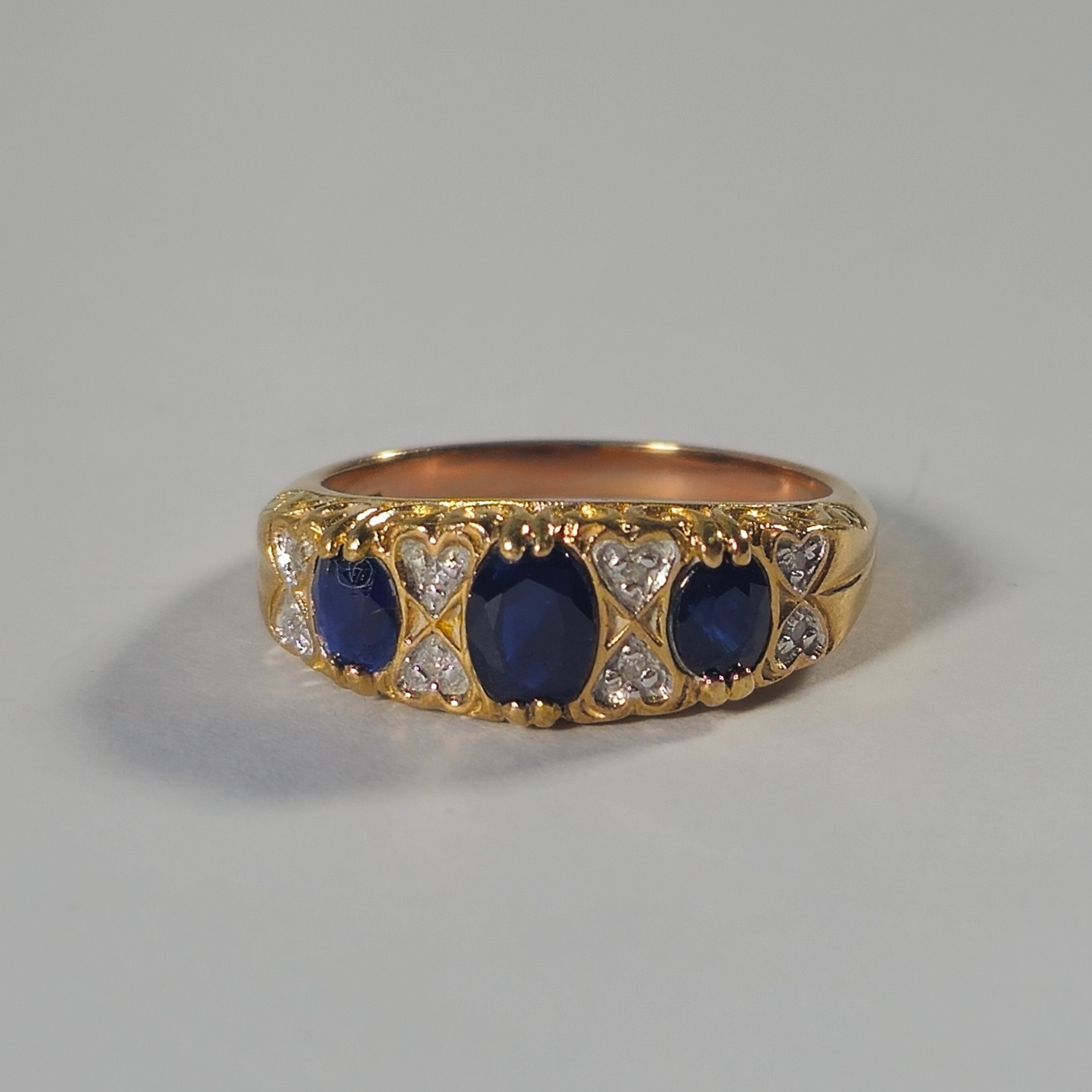 Product photo for 9ct Gold Sapphire & Diamond Half Band Ring Size M