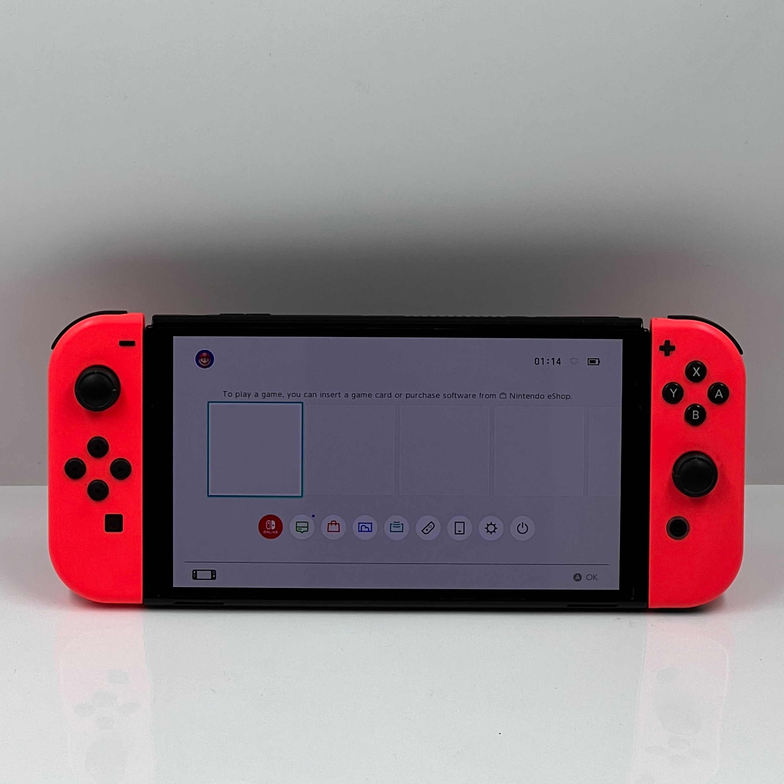 Product photo for OLED NINTENDO SWITCH CONSOLE WITH RED JOYCONS AND 128GB SD CARD