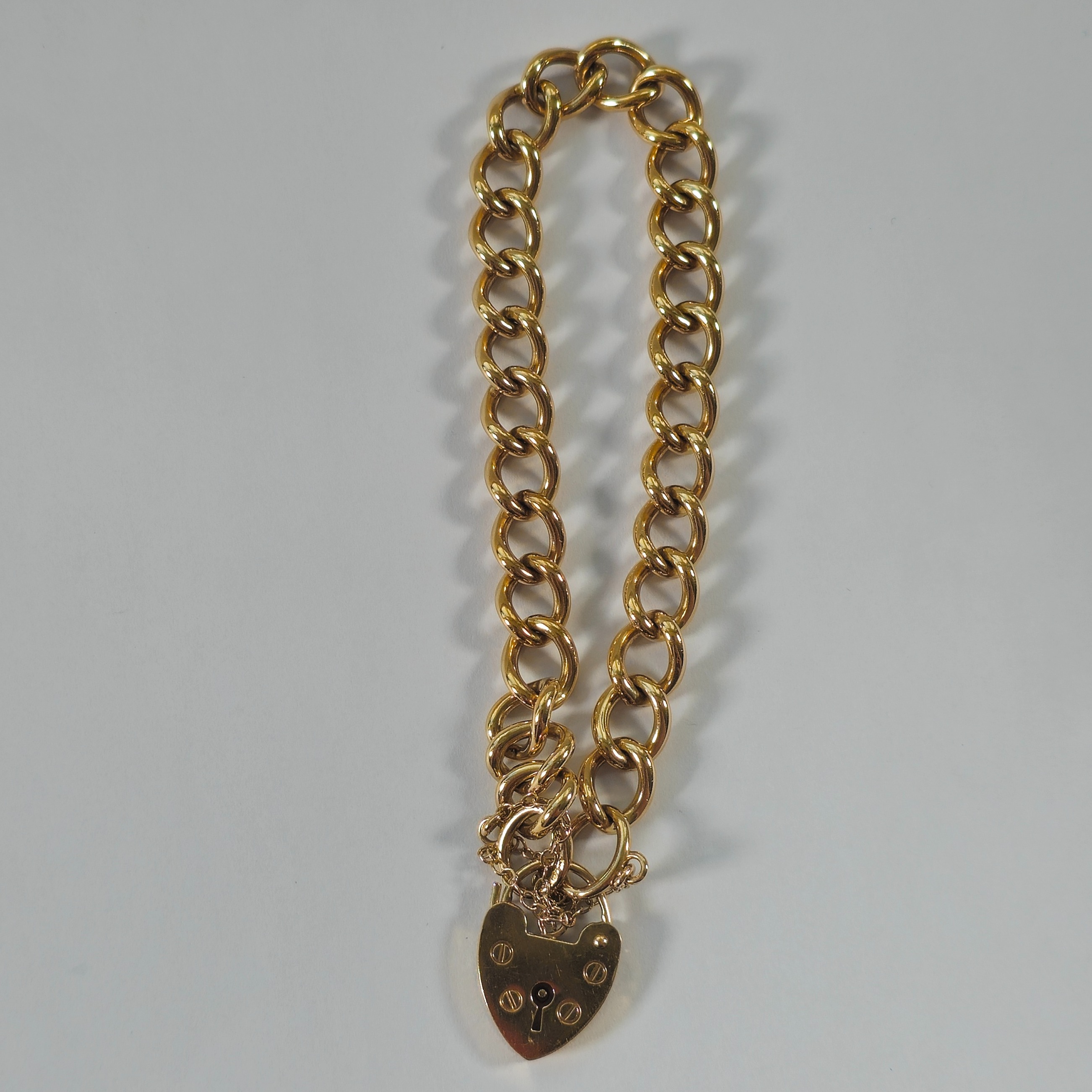 Product photo for 9ct Gold Oval Twisted Curb Padlock Bracelet