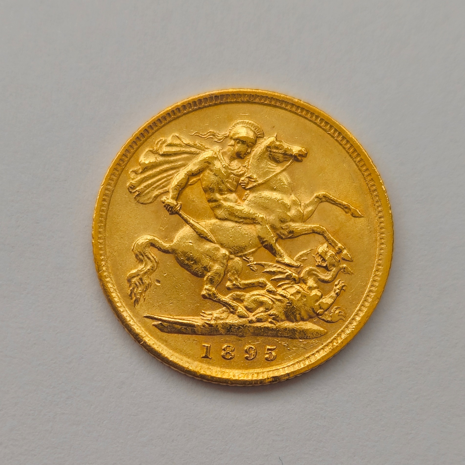 Product photo for 22ct Gold 1895 Victoria and St George & the dragon Half Sovereign Coin