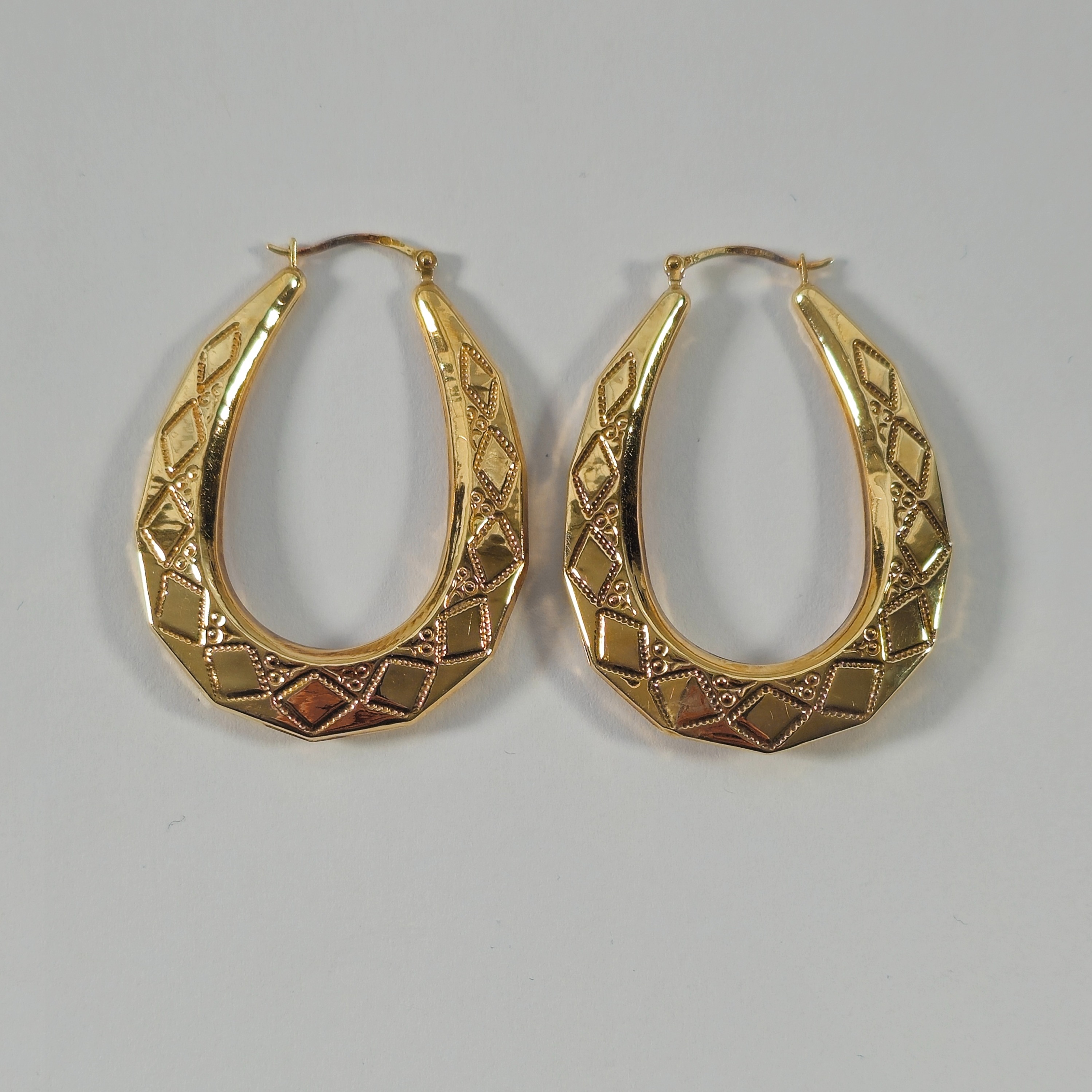 Product photo for 9ct Gold Diamond Shape Pattern Long Oval Hoop Earrings