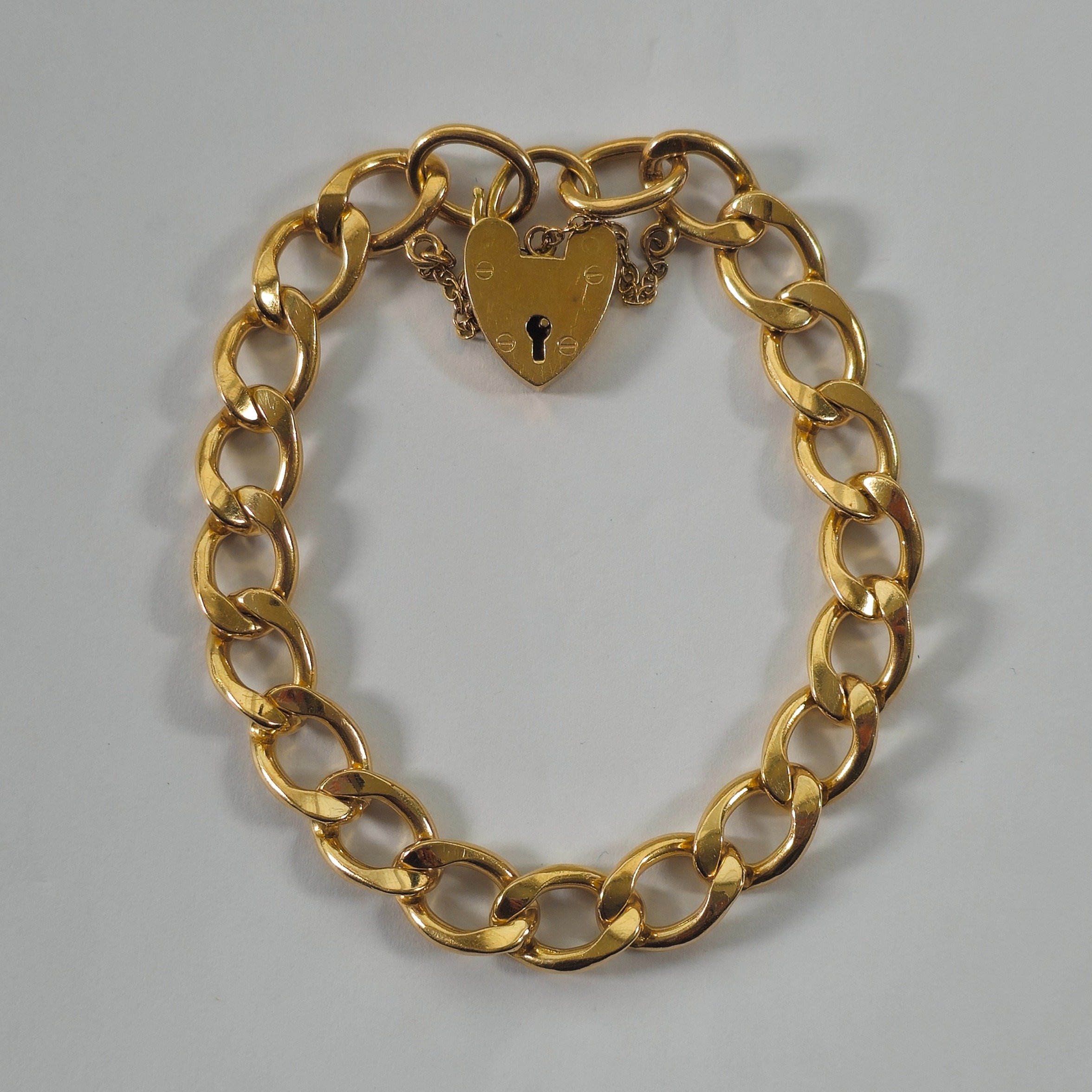 Product photo for 9ct Gold Curb Heart Padlock Bracelet