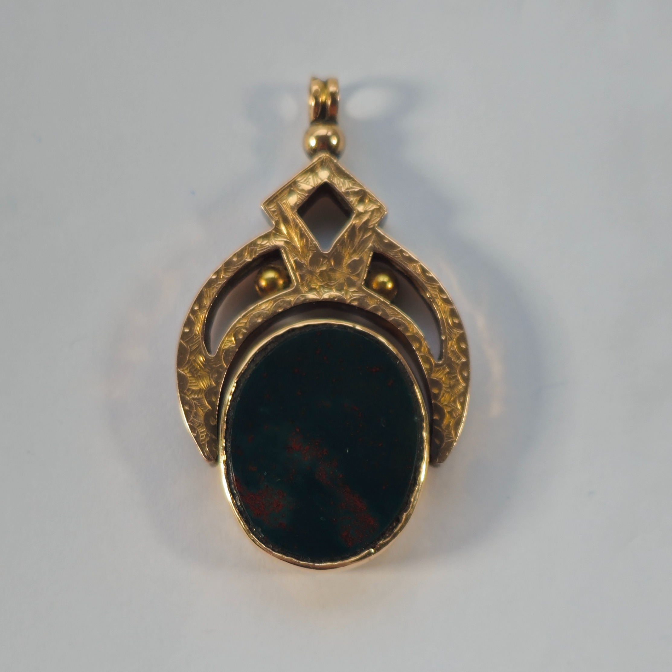 Product photo for 9ct Gold Orange & Blood Stone Spinner Pendant