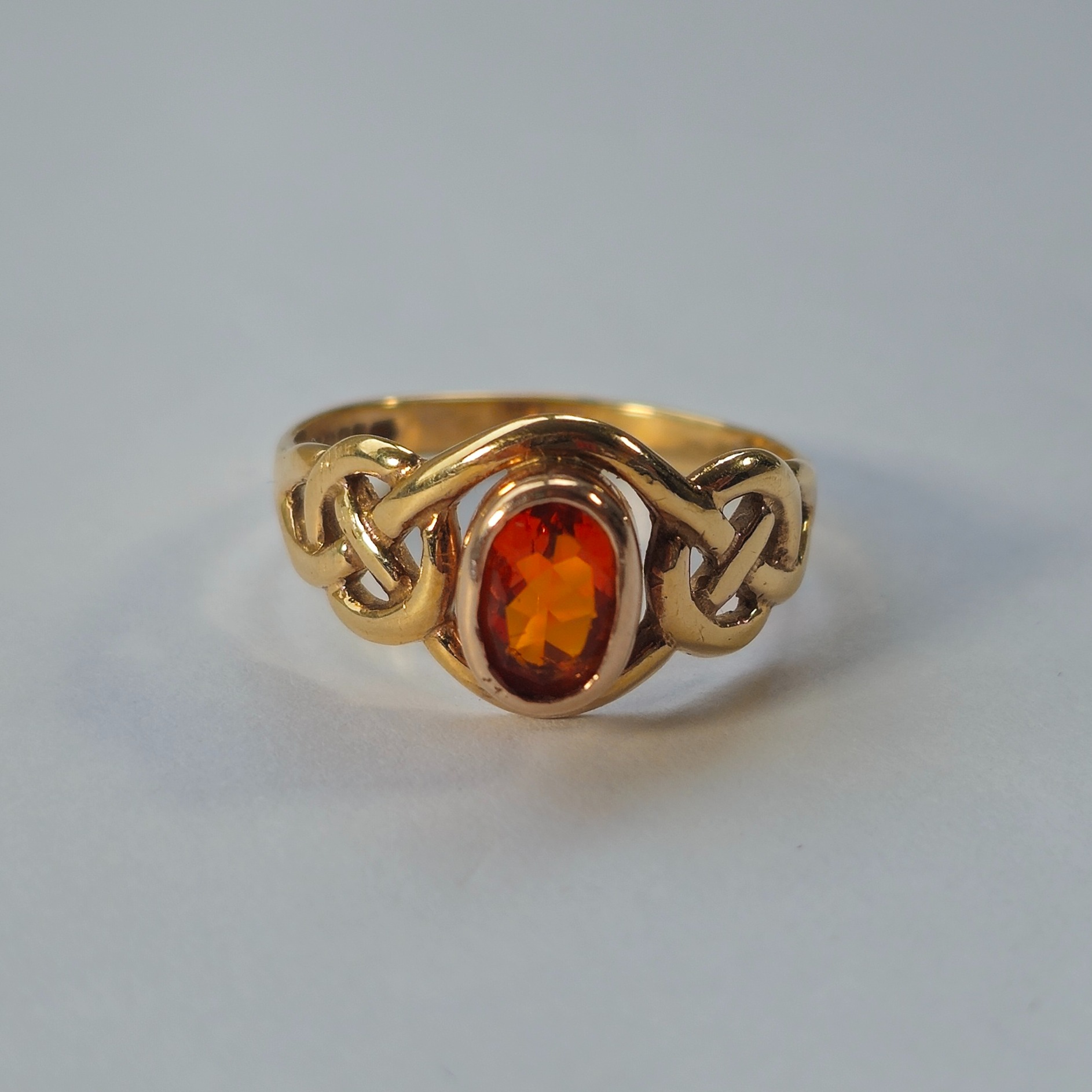 Product photo for Clogau 9ct Gold Fire Opal Celtic Shoulders Ring Size O1/2