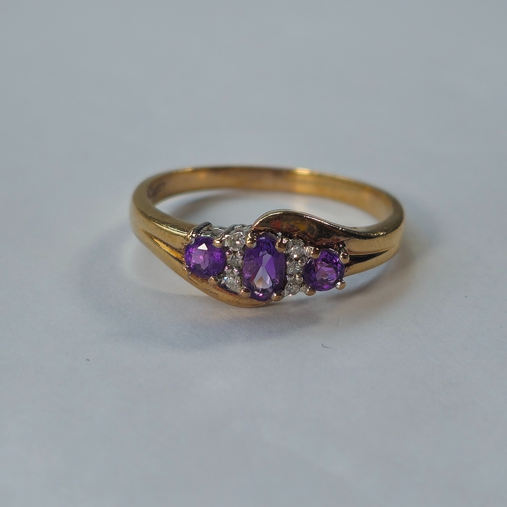 Product photo for 9ct Gold Diamond & Purple Stone Trilogy Style Ring Size R