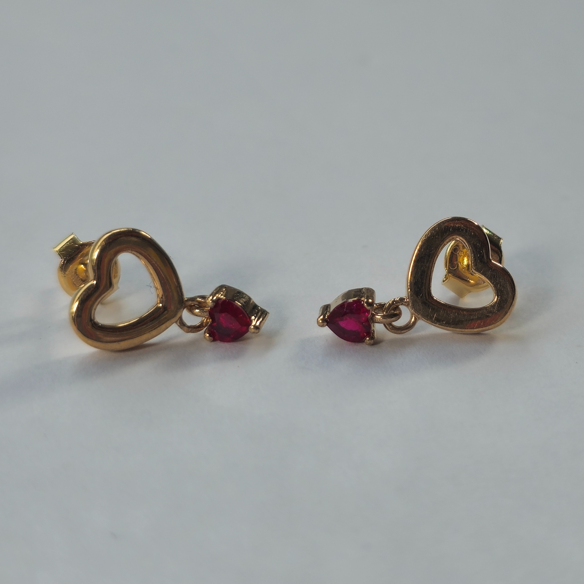 Product photo for 9ct Gold Ruby Stone Heart Dangle Stud Earrings by Glamira