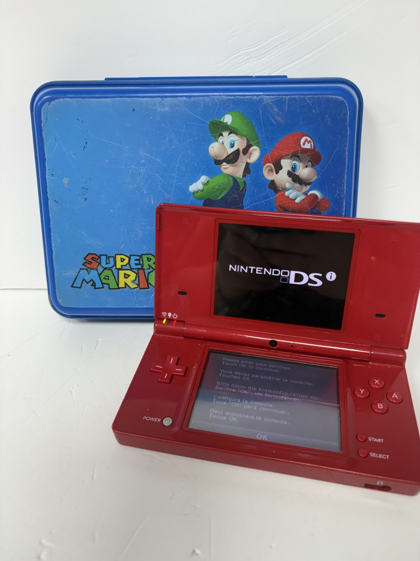 Product photo for NINTENDO Nintendo dsi red with Mario case and 12 LOOSE games