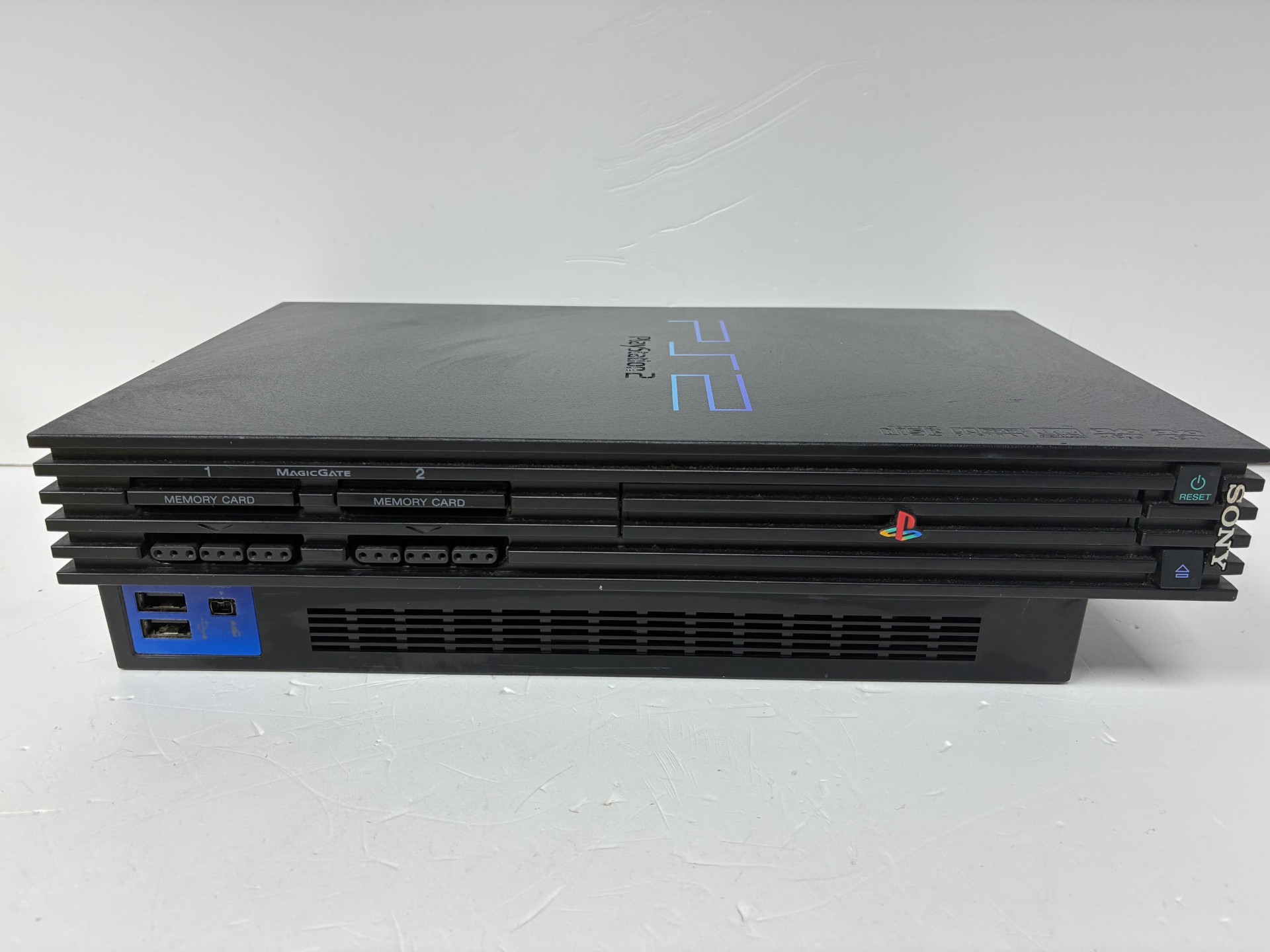 Product photo for sony ps2 console unboxed with controllers