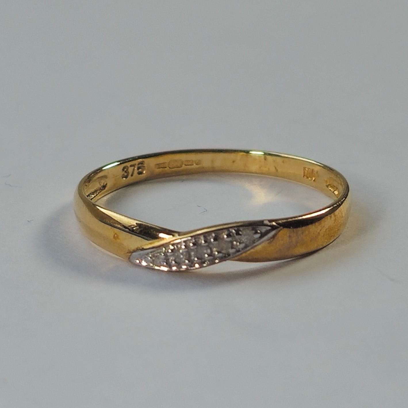 Product photo for 9ct Gold Tiny Diamond Infinity Style Band Ring Size M1/2
