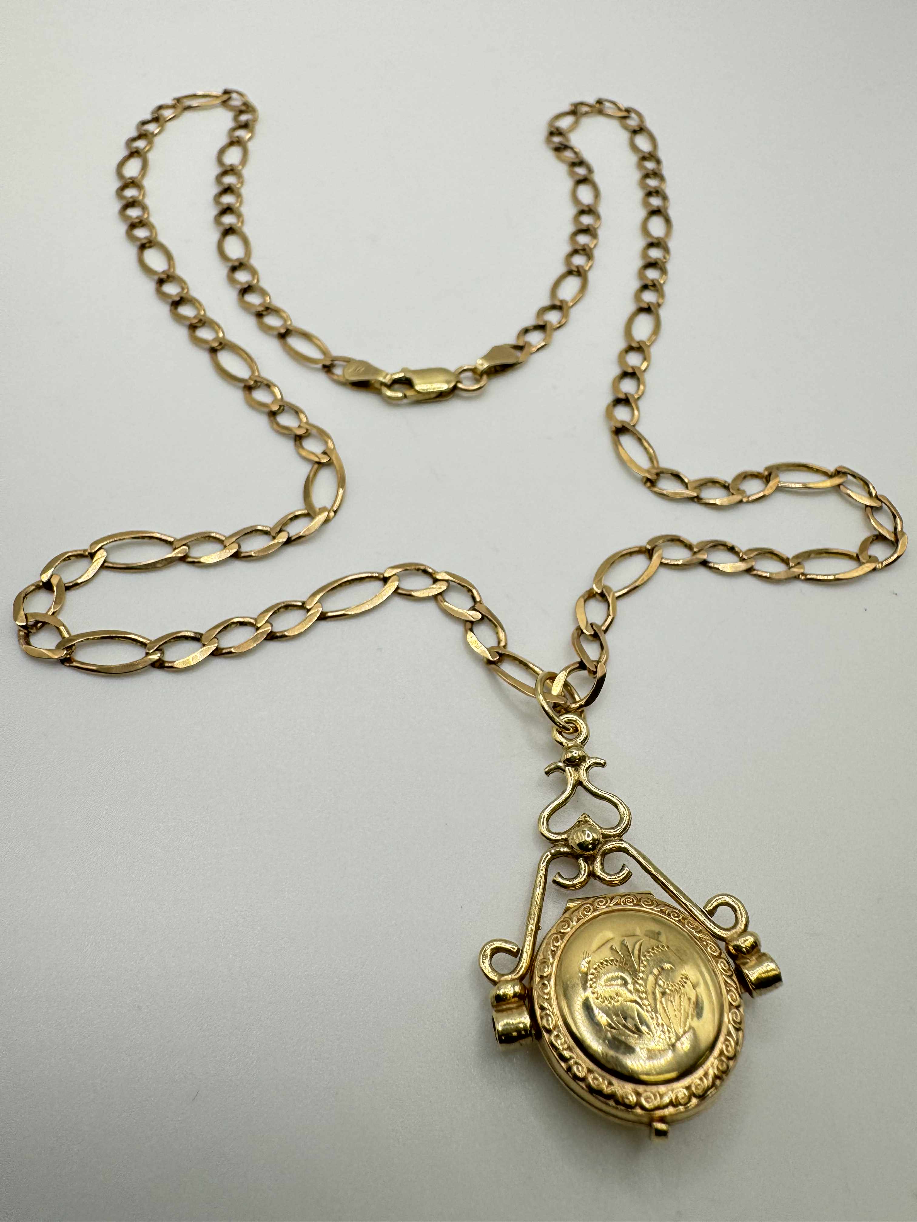 Product photo for 9ct Figaro Chain & Spinning Locket Pendant