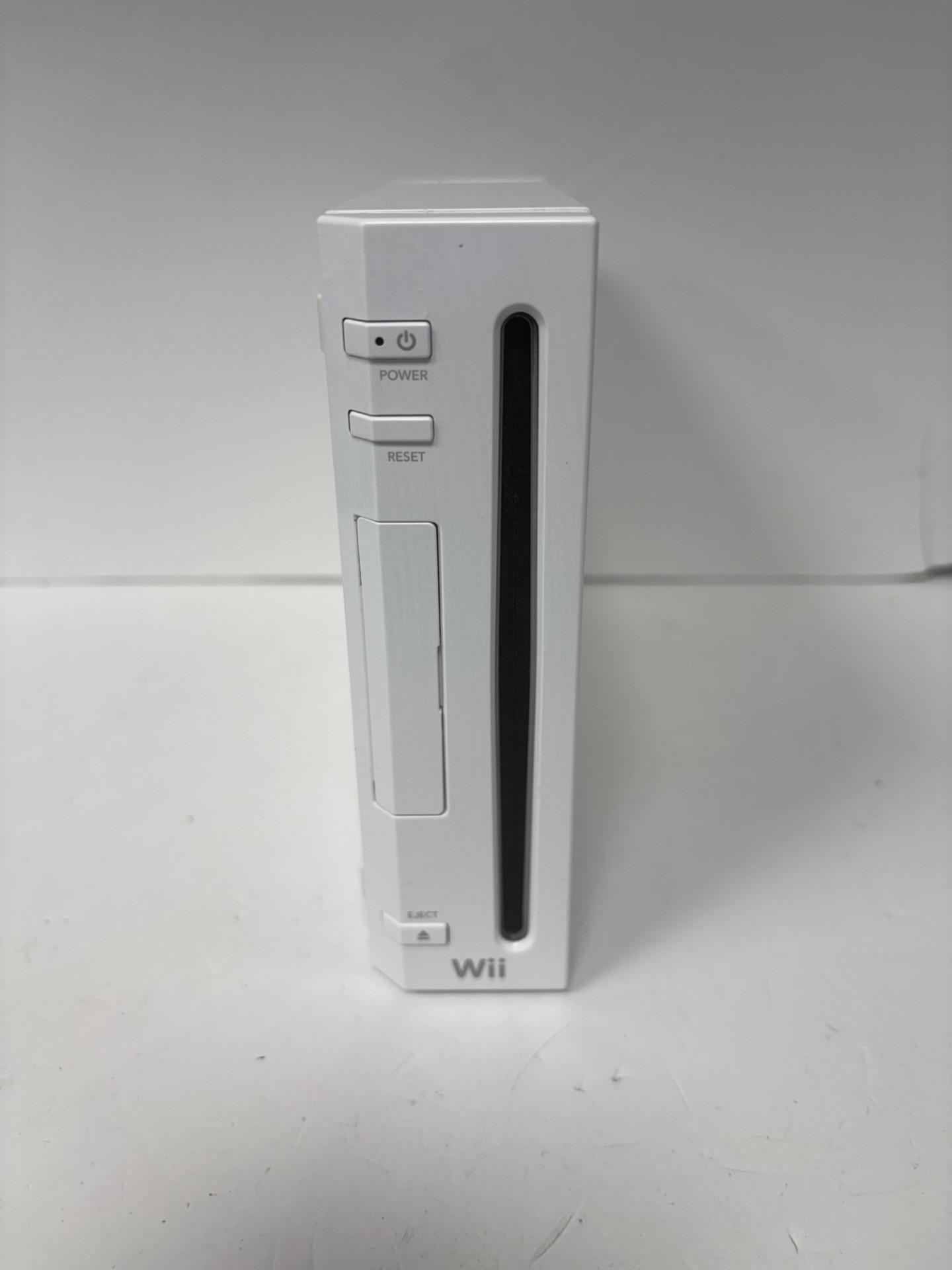 Product photo for Nintendo Wii console white with wires and 3 controllers unboxed
