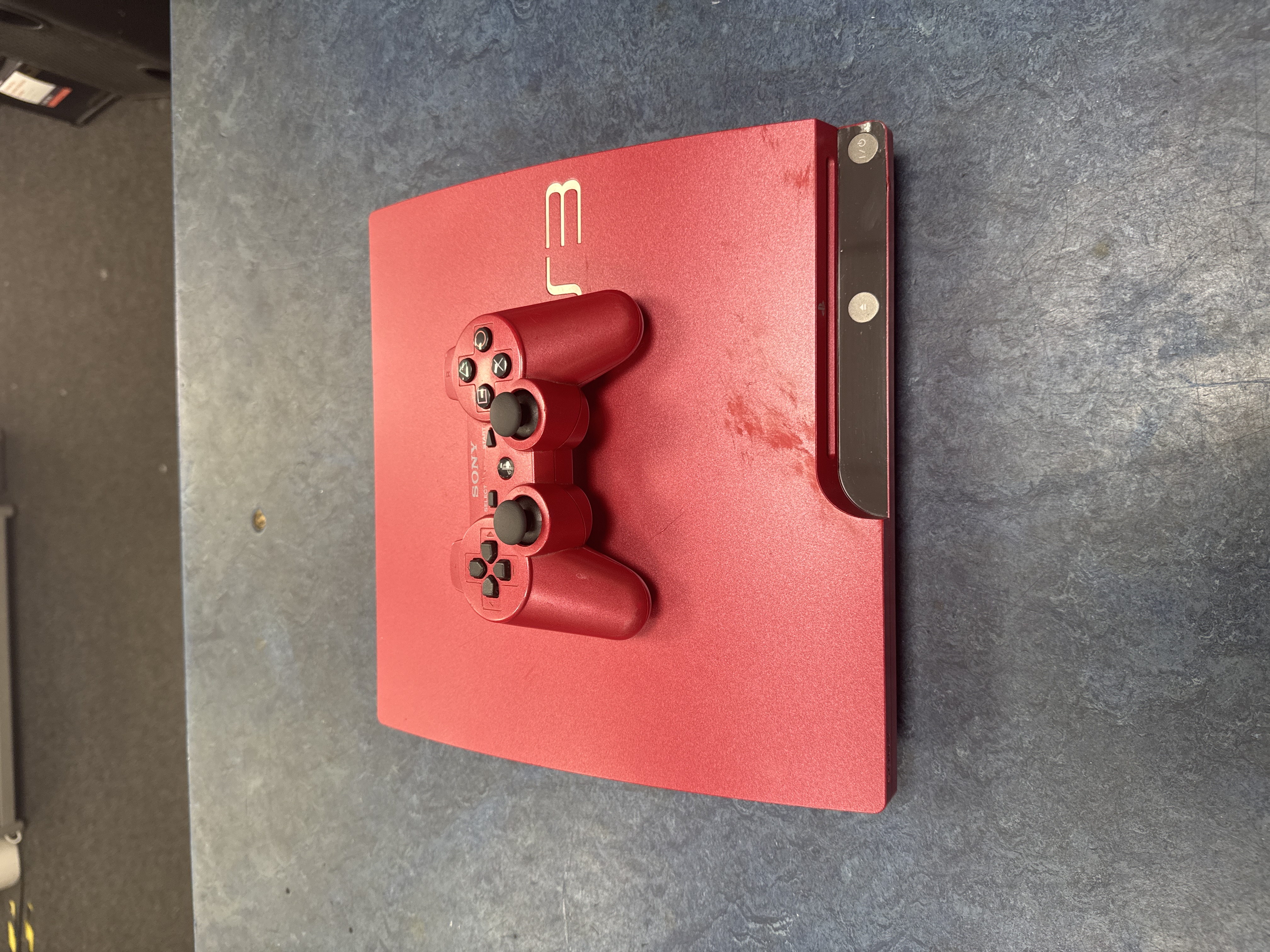 Product photo for Sony ps3 slim scarlett red edition with controller