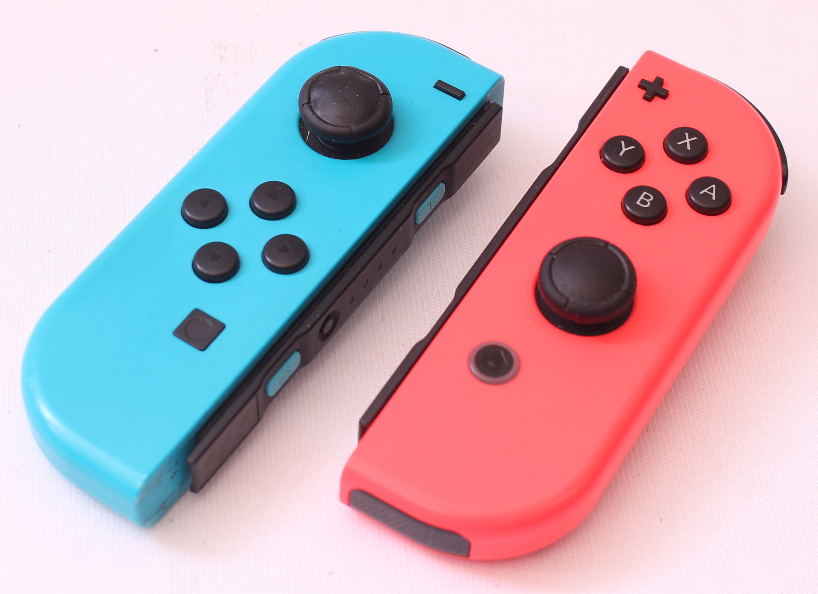 Product photo for Nintendo Switch Joy-Con Controller Pair - Neon Red & Blue SPARES (PNW)