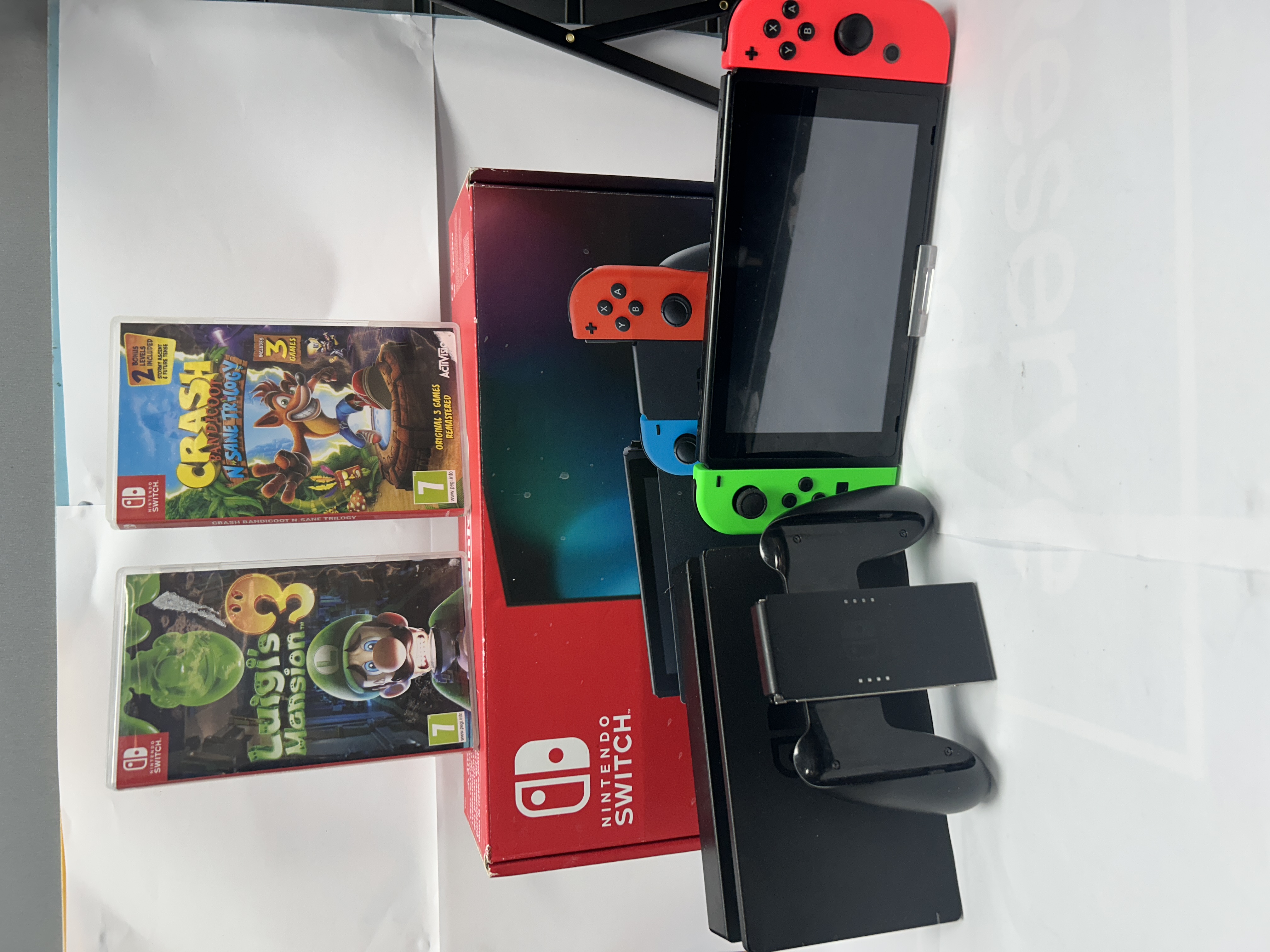 Product photo for switch console boxed with accessories and 2 games