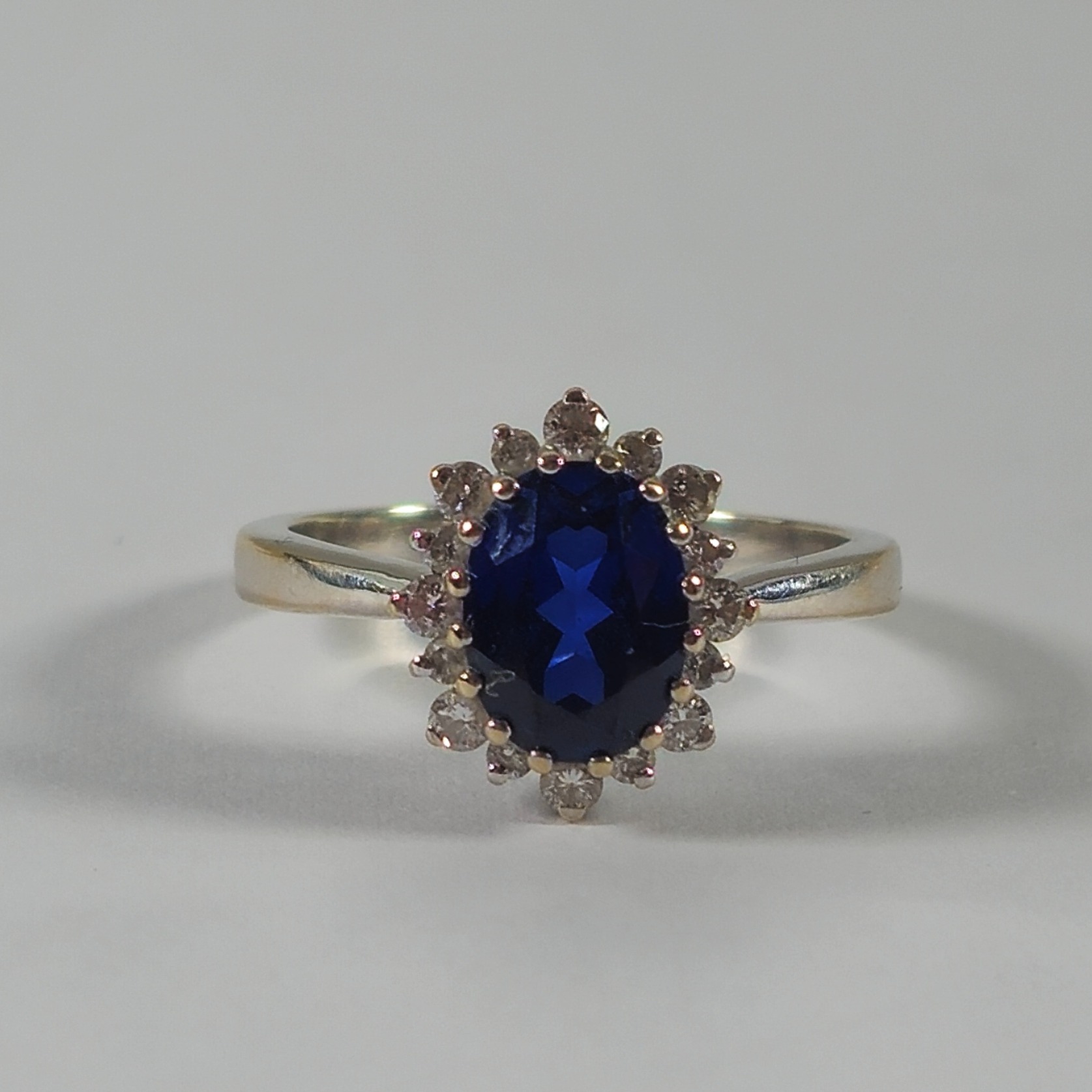 Product photo for 18ct White Gold Synthetic Blue Sapphire & Diamond Flower Style Ring Size I1/2