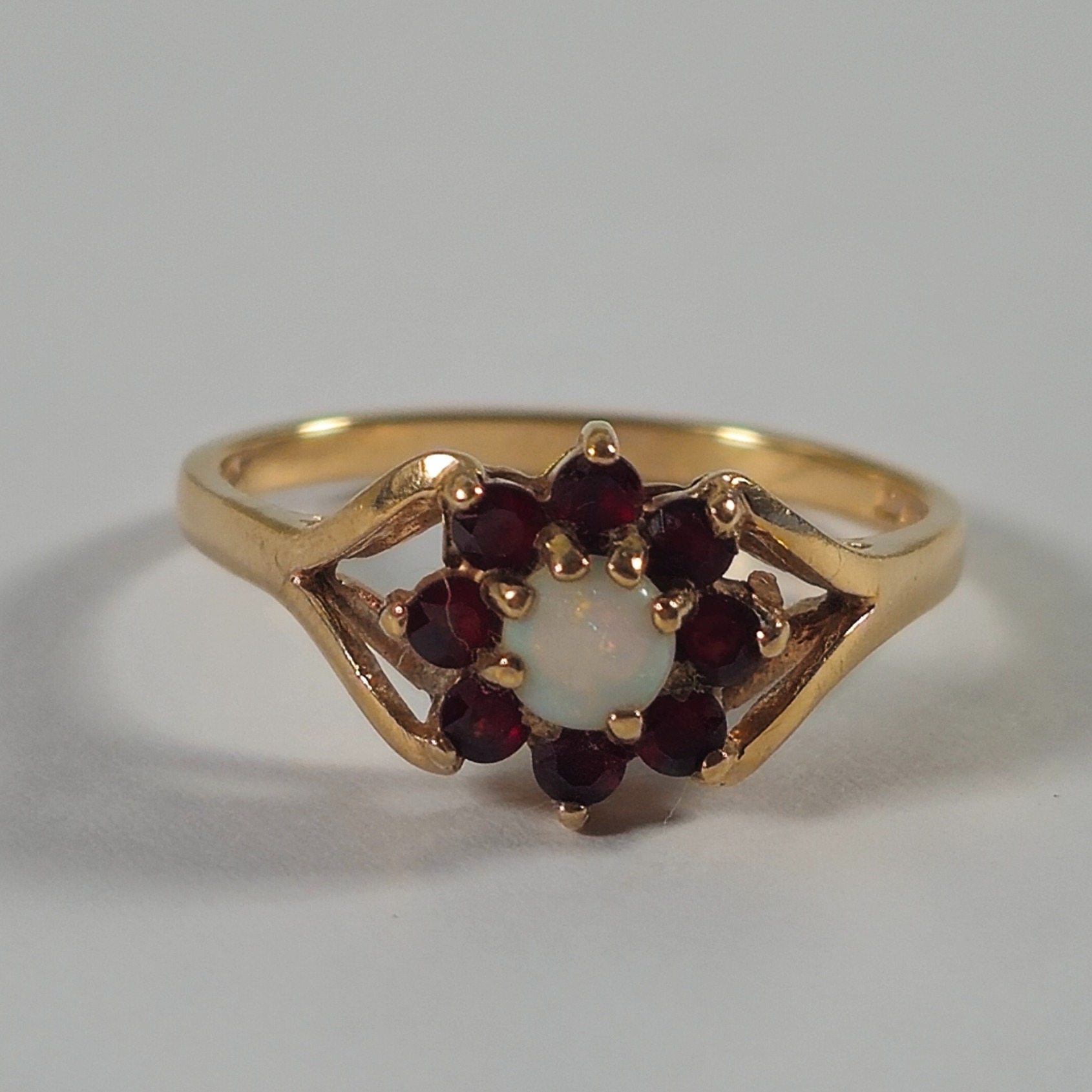 Product photo for 9ct Gold Opal & Garnet Flower Ring Size O1/2
