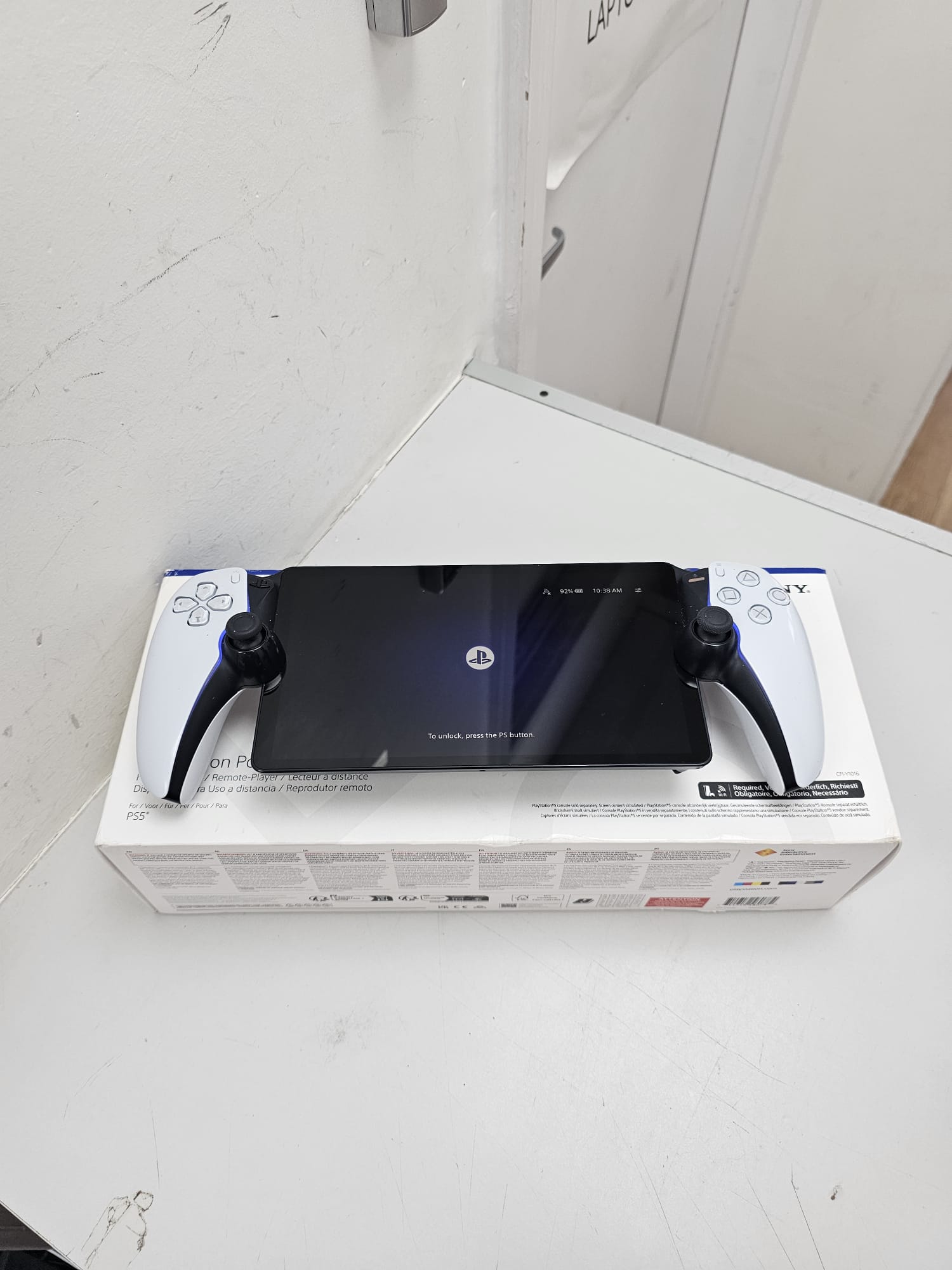 Product photo for PlayStation Portal with charging cable and box