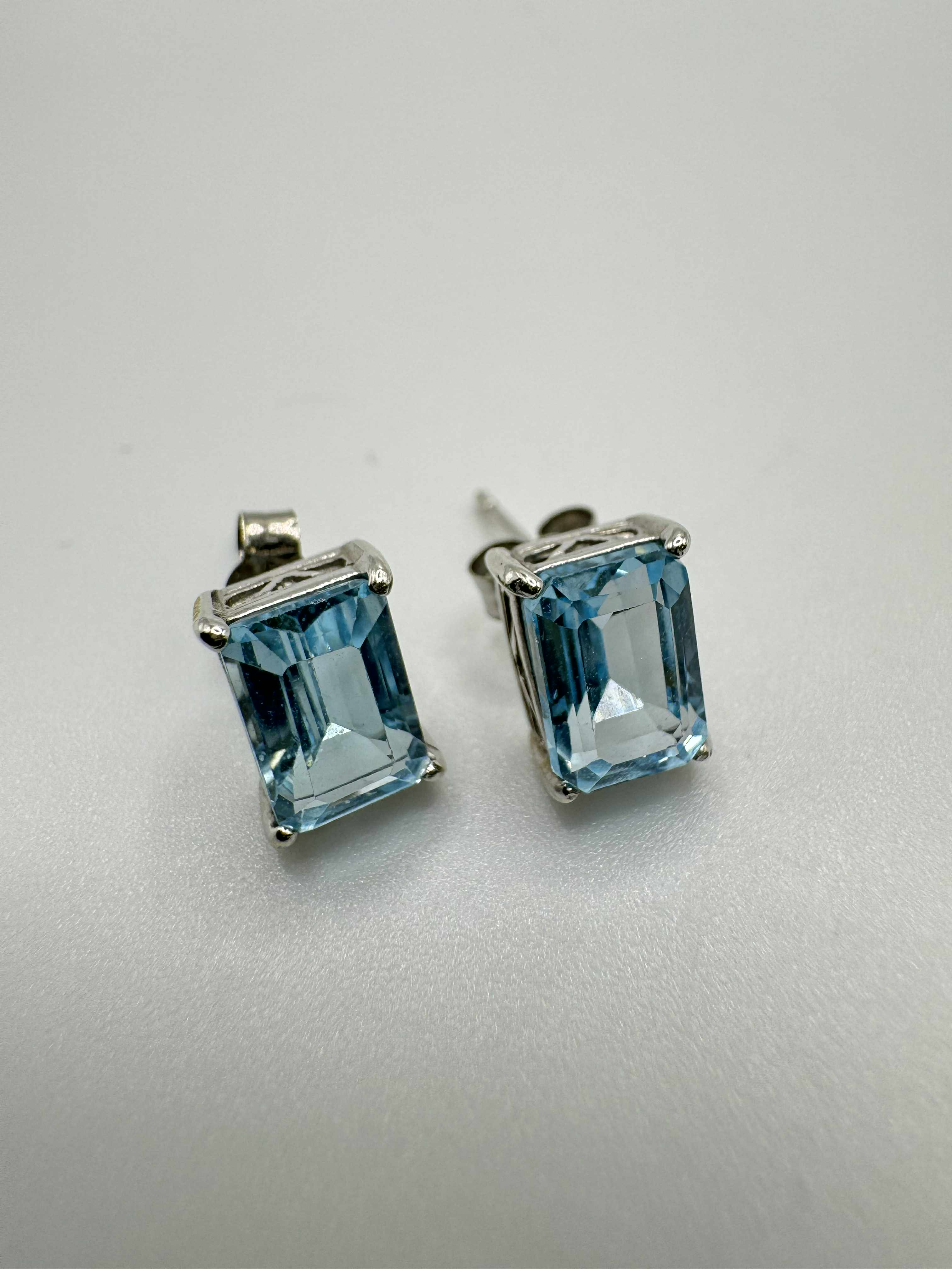 Product photo for 9ct White Gold Blue Topaz Stud Earrings