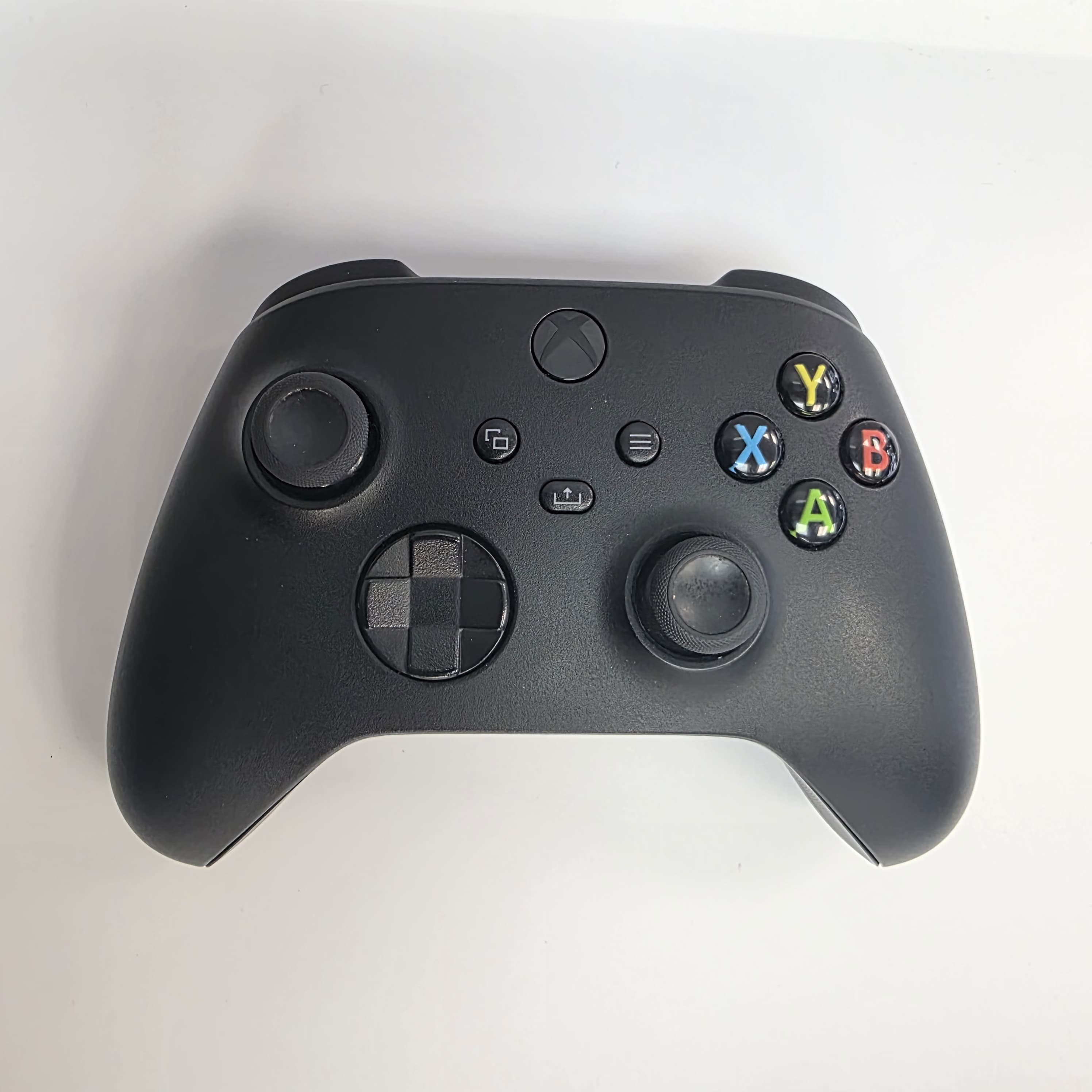 Product photo for Official Xbox Series Carbon Black Wireless Controller with Giotech battery pack.
