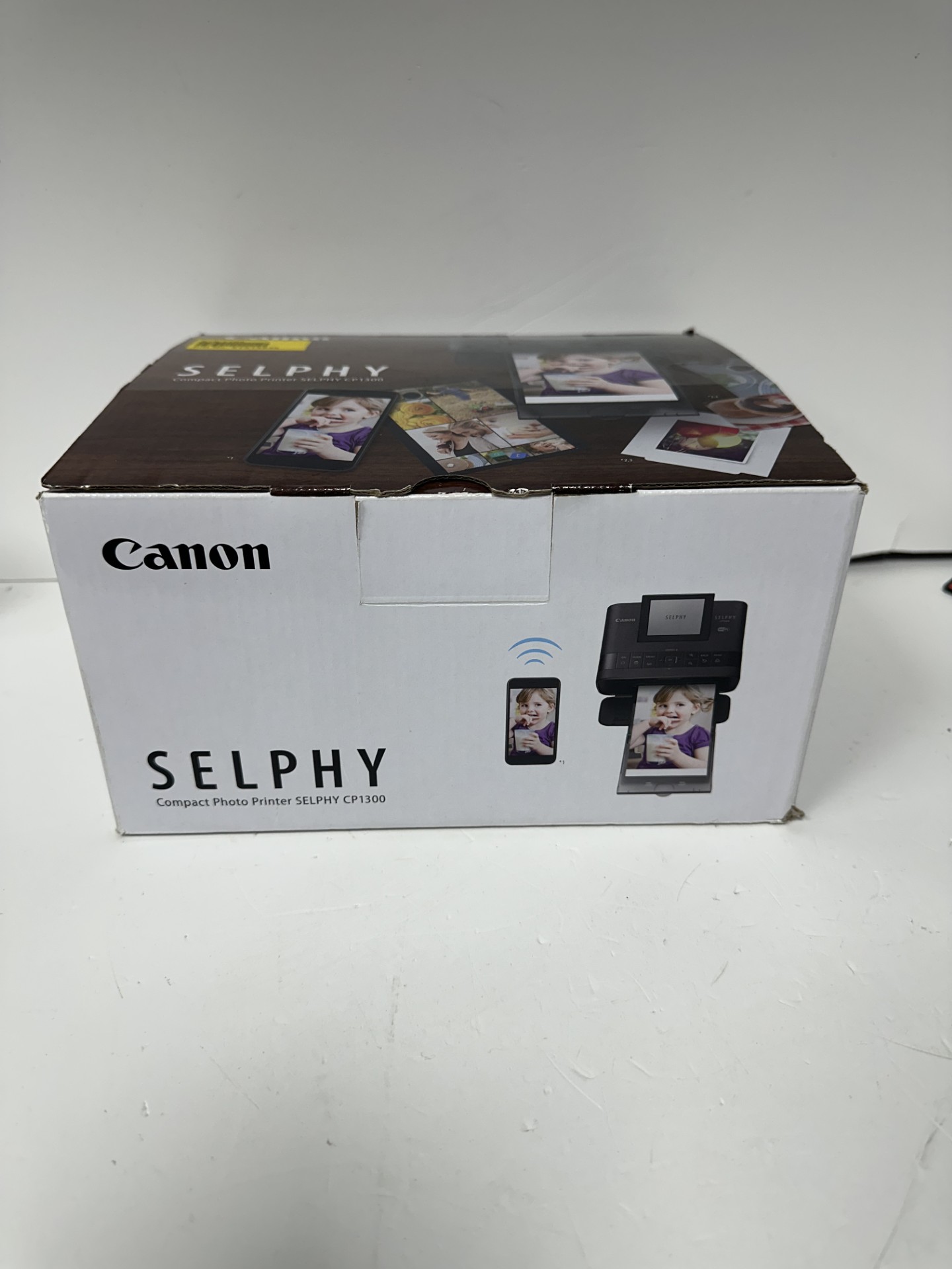 Product photo for CANON canon selphy compact photo printer cp1300 boxed