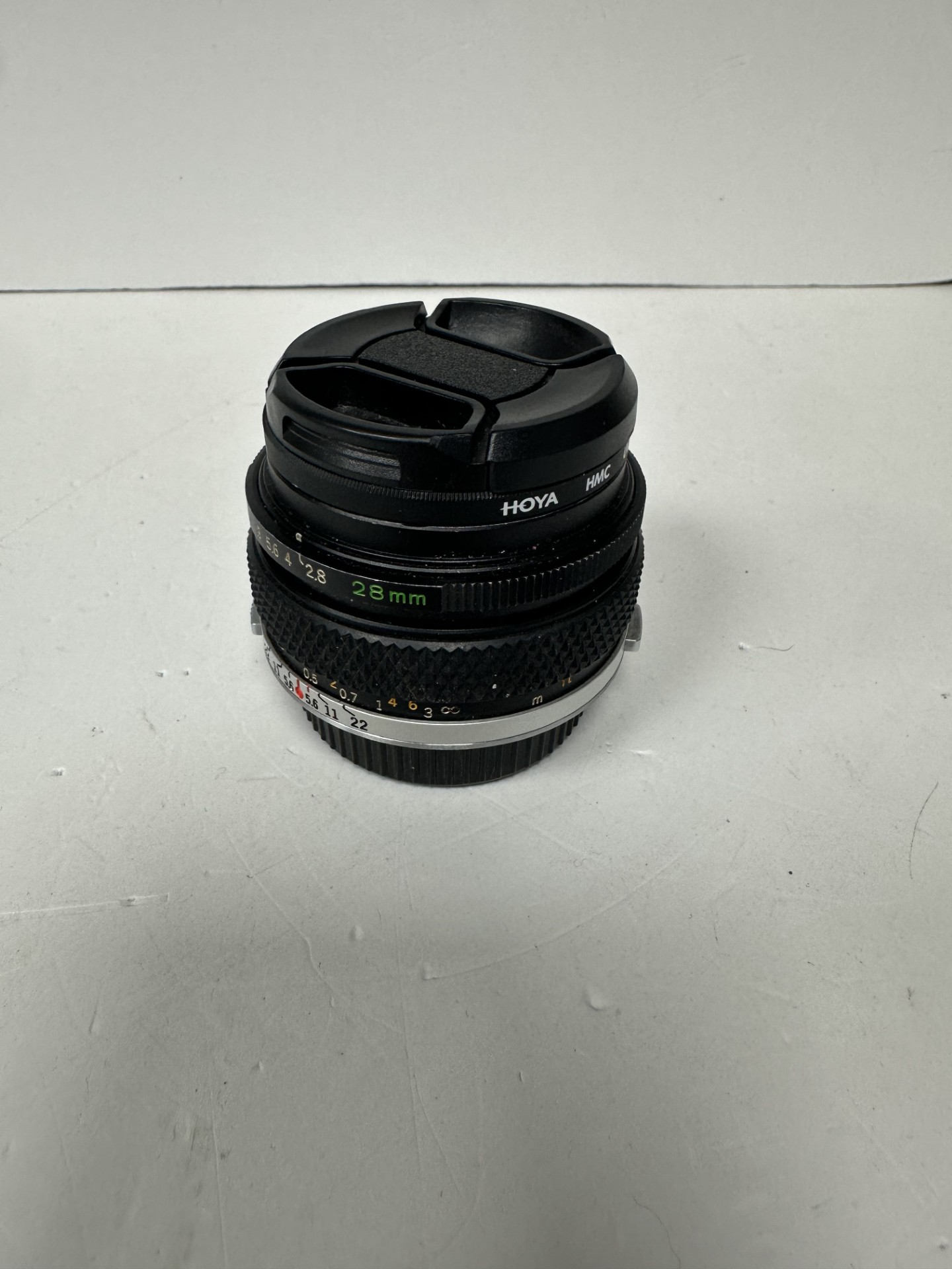 Product photo for hoya 49mm lens unboxed