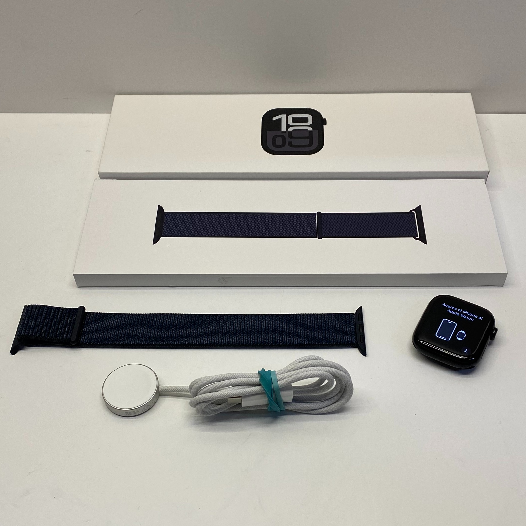Product photo for Apple Watch Series 10 42mm Jet Black Aluminum Case Ink Sport Loop Boxed