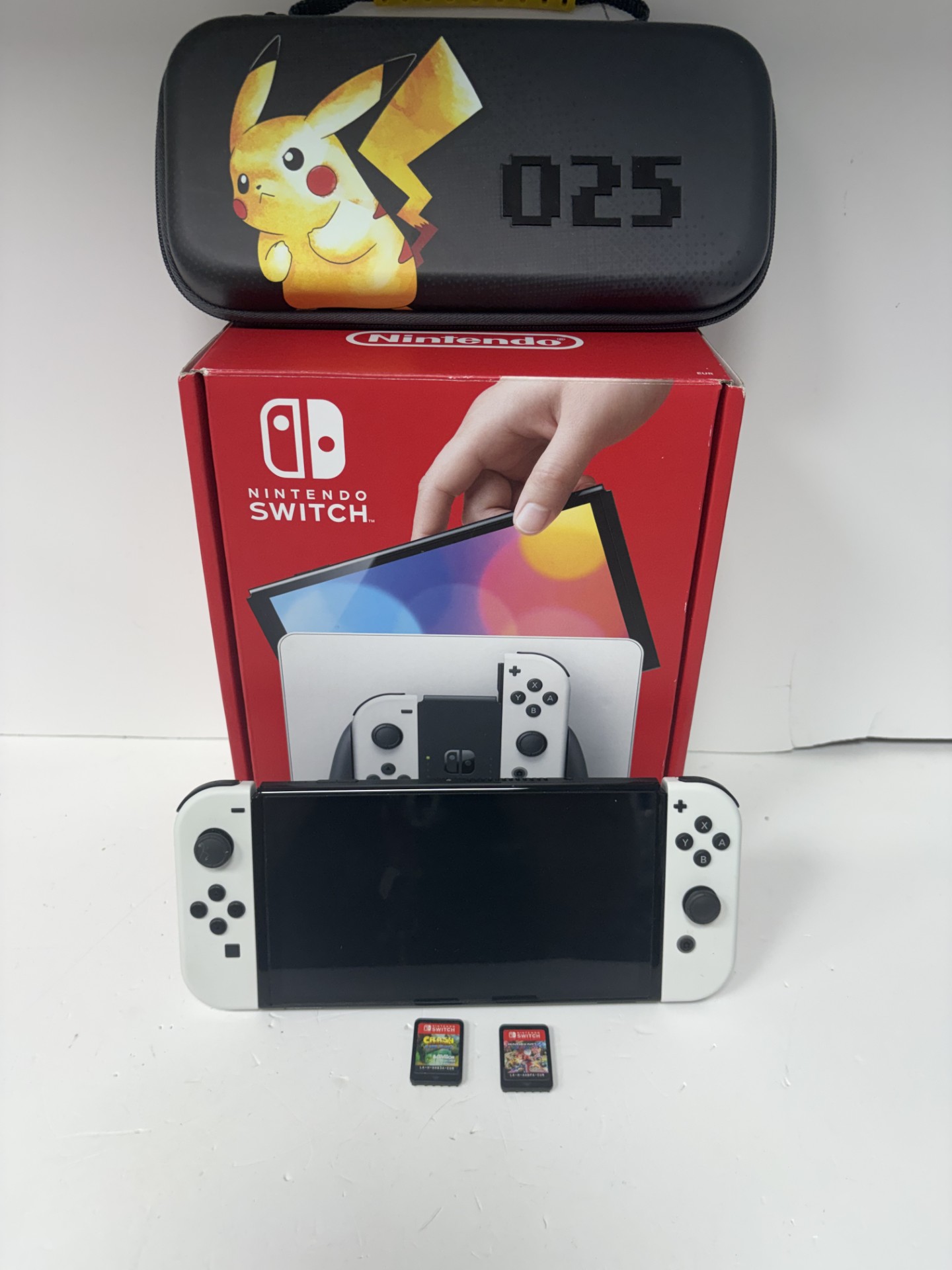 Product photo for NINTENDO SWITCH OLED IN CASE WITH 2 GAMES BOXED