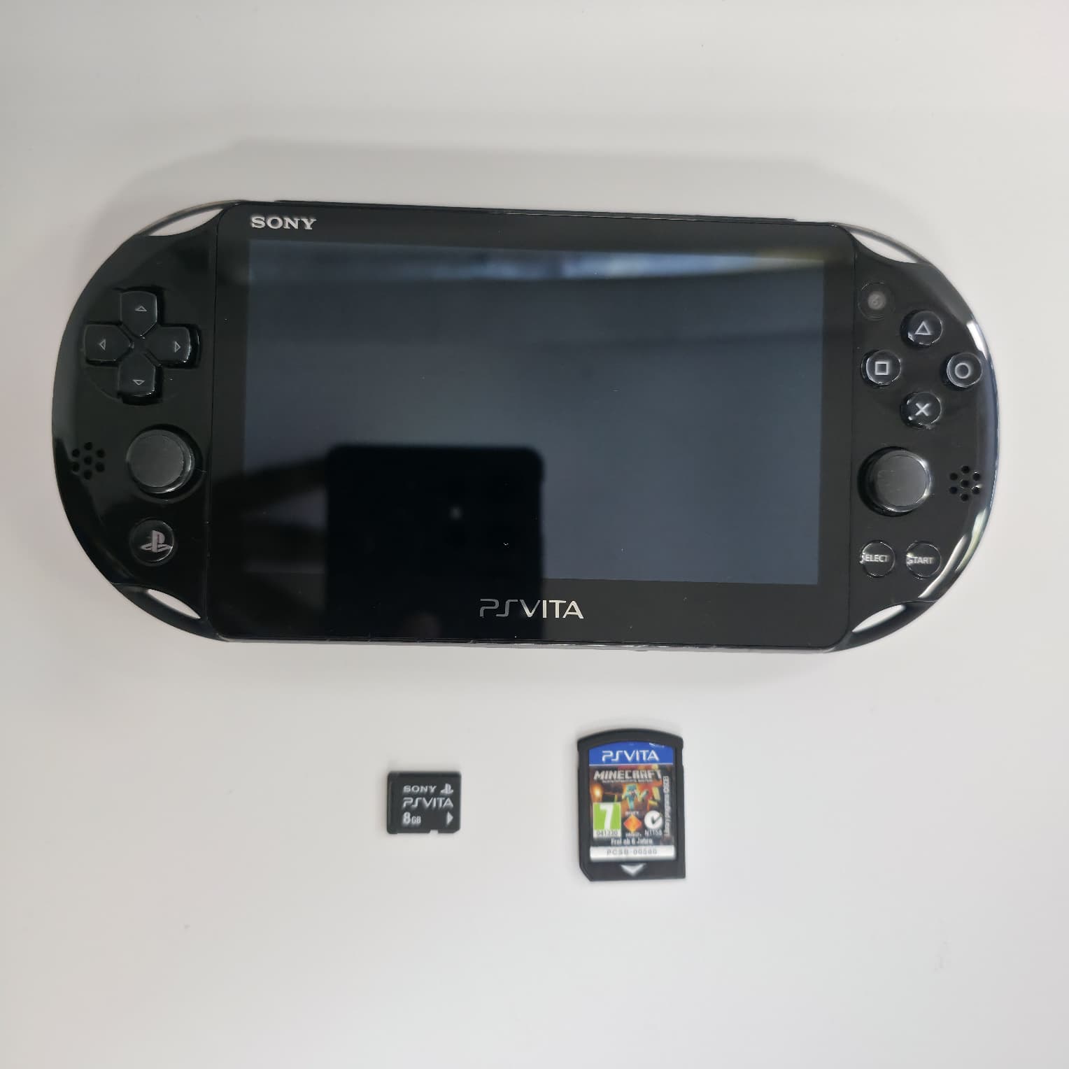 Product photo for Sony PlayStation Vita Slim Console PCH-2016 with Minecraft game
